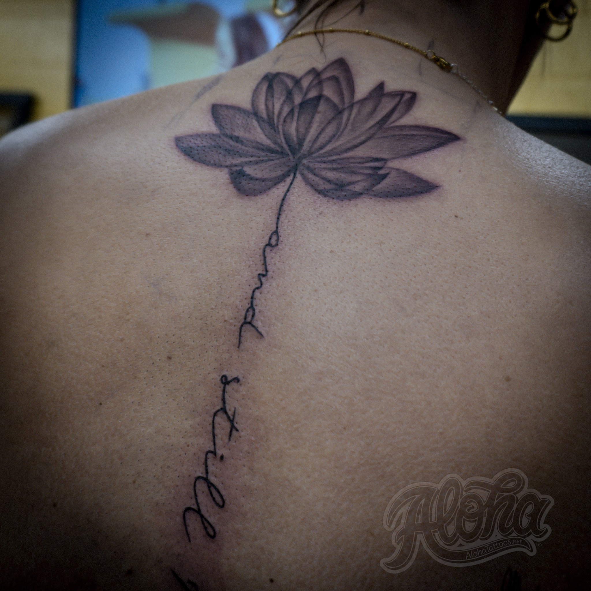 Black and grey illustrative tattoo