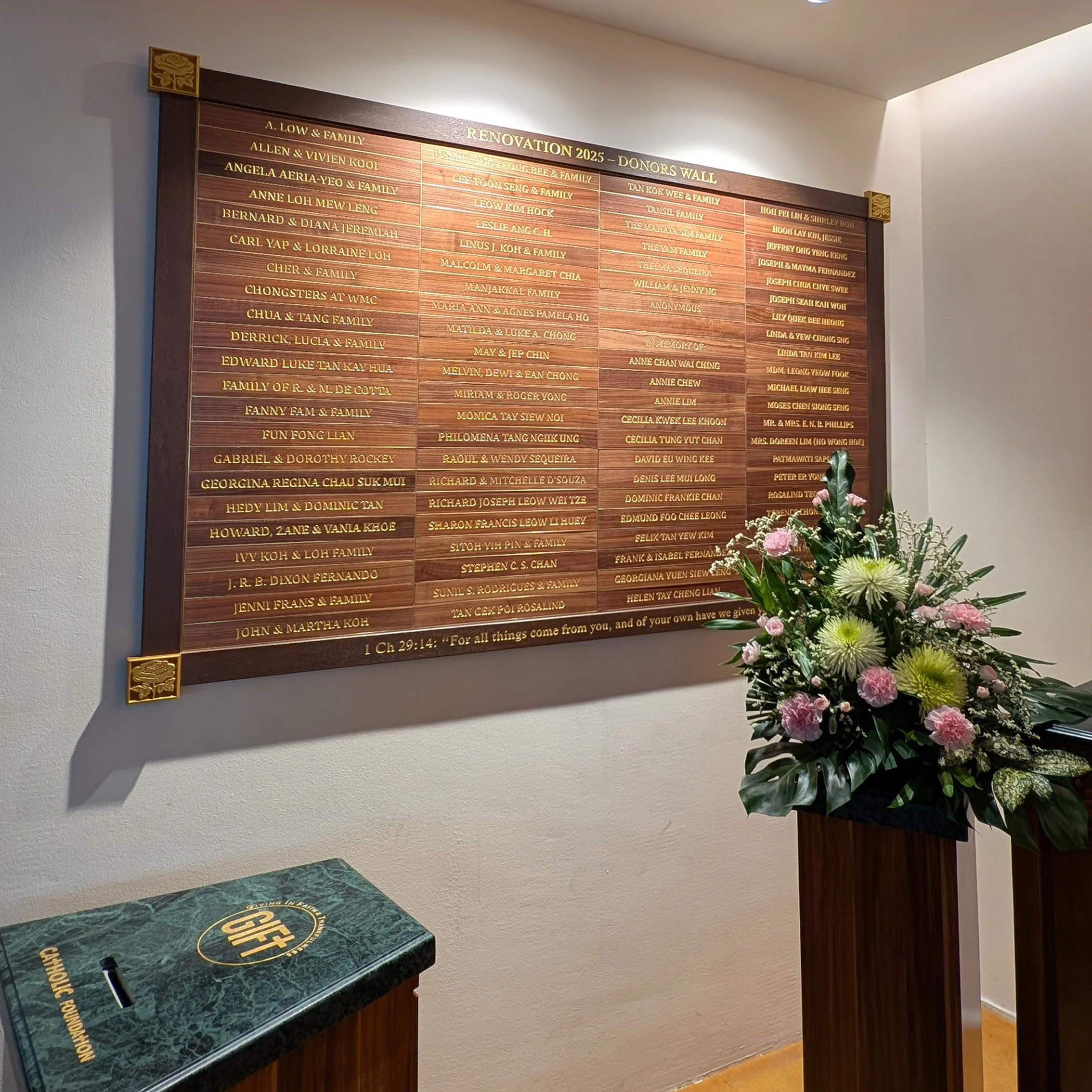 Handcrafted timber donor wall with engraved walnut nameplates, custom designed to honour church renovation contributors and benefactors.
