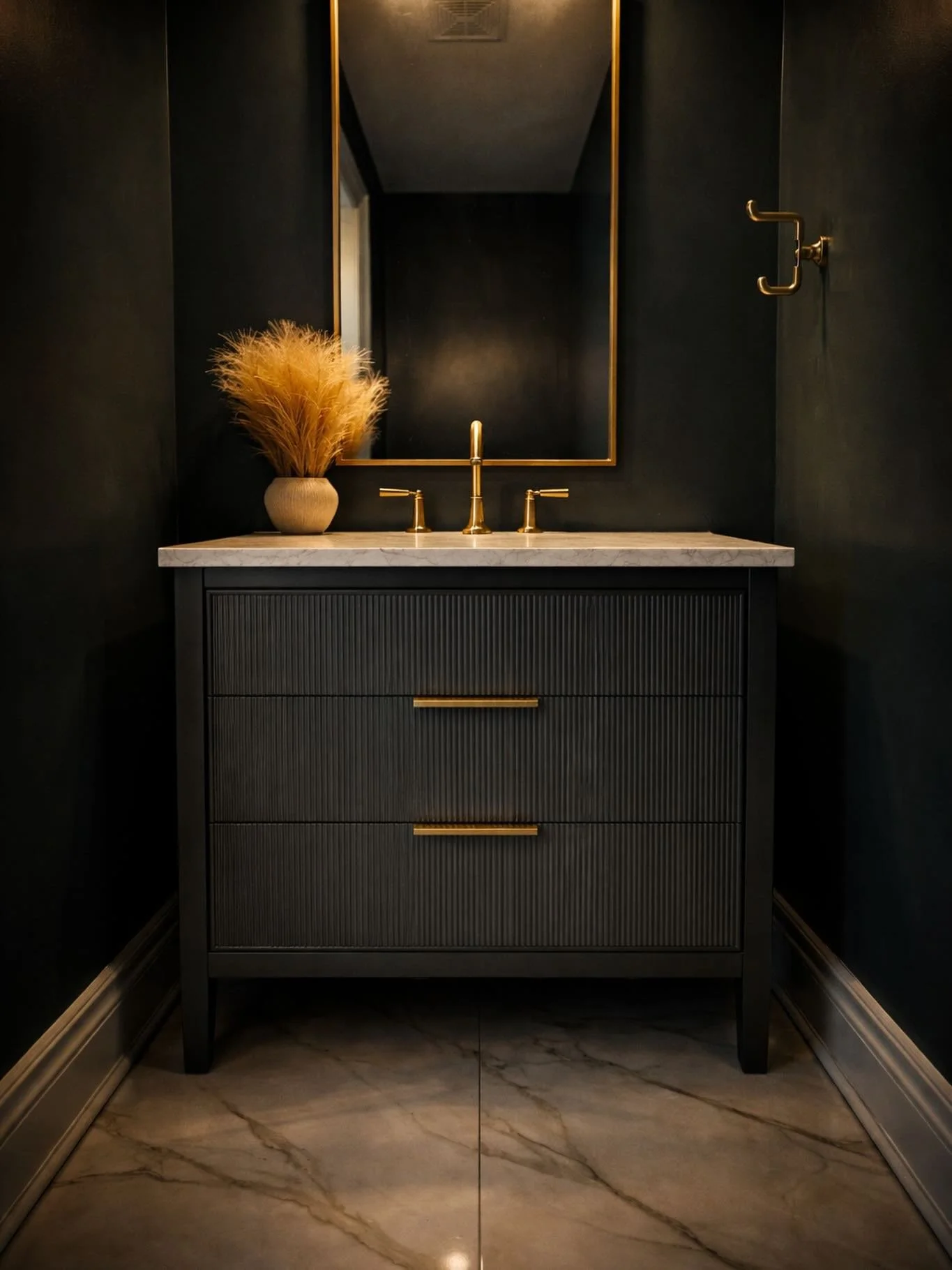 This moody powder room proves that small spaces can make the biggest statement. Black walls, fluted vanity detail, warm brass accents, and a crisp stone top tying it all together. ✨

Powder rooms are where you take risks &mdash; and this one paid off