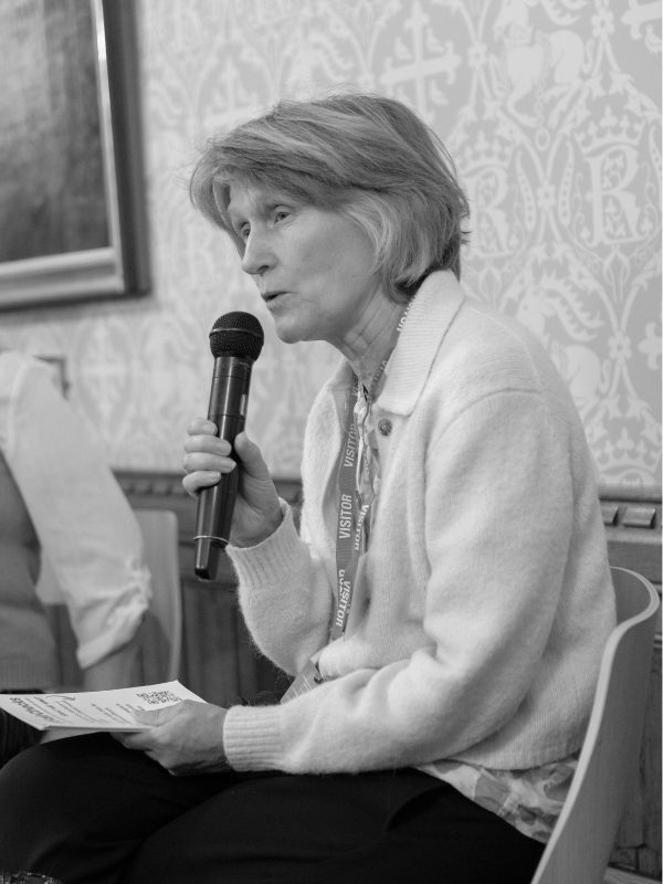 Black and white photo of Transform Justice's Penelope Gibbs speaking at a parliamentary reception at the 2024 W&J Summit in London.