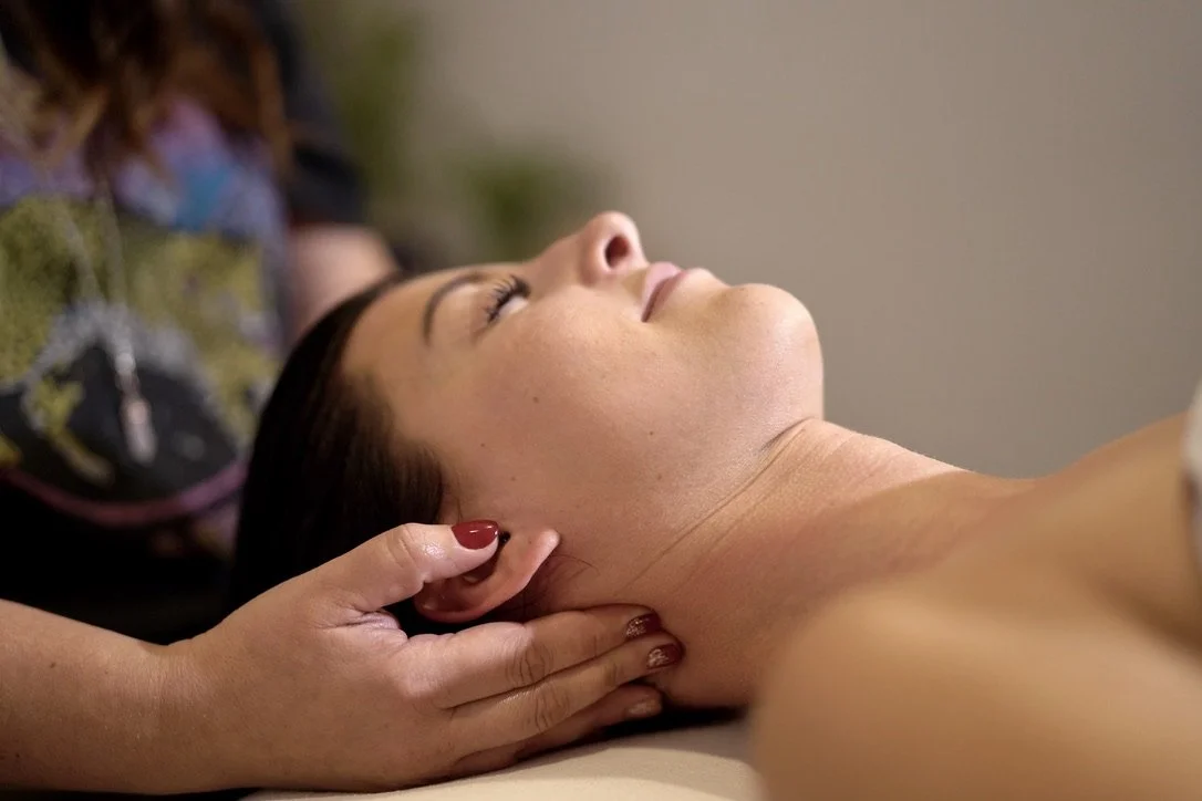 Britiny providing massage therapy at Pure Bliss Massage & Day Spa