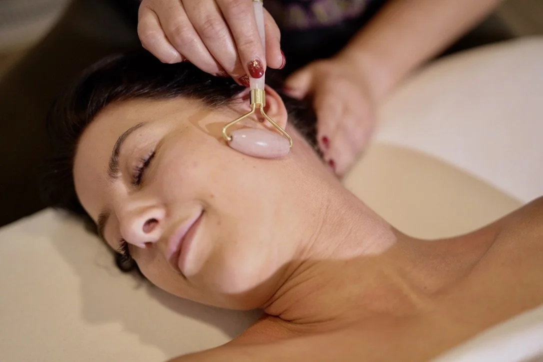 Client receiving a relaxing facial treatment at Pure Bliss Massage & Day Spa in Sundre, Alberta.
