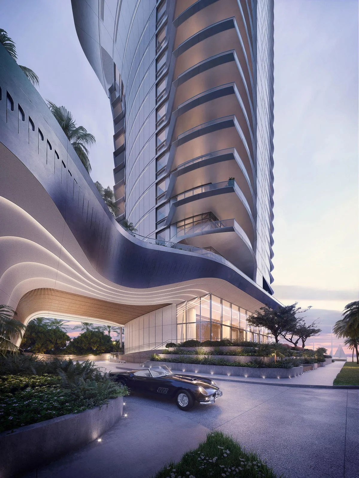 Modern high-rise building with a curved facade, featuring balconies and large windows, surrounded by landscaped greenery and a classic convertible car in the driveway.