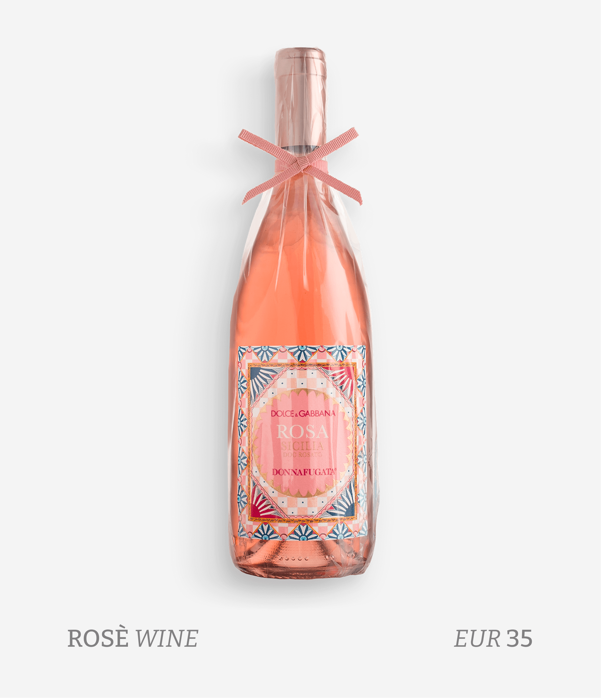 A bottle of pink rosé wine wrapped in clear plastic with a pink ribbon tied around the neck, featuring a decorative label with pink, blue, and orange patterns. Text below indicates it is rosé wine costing EUR 35.