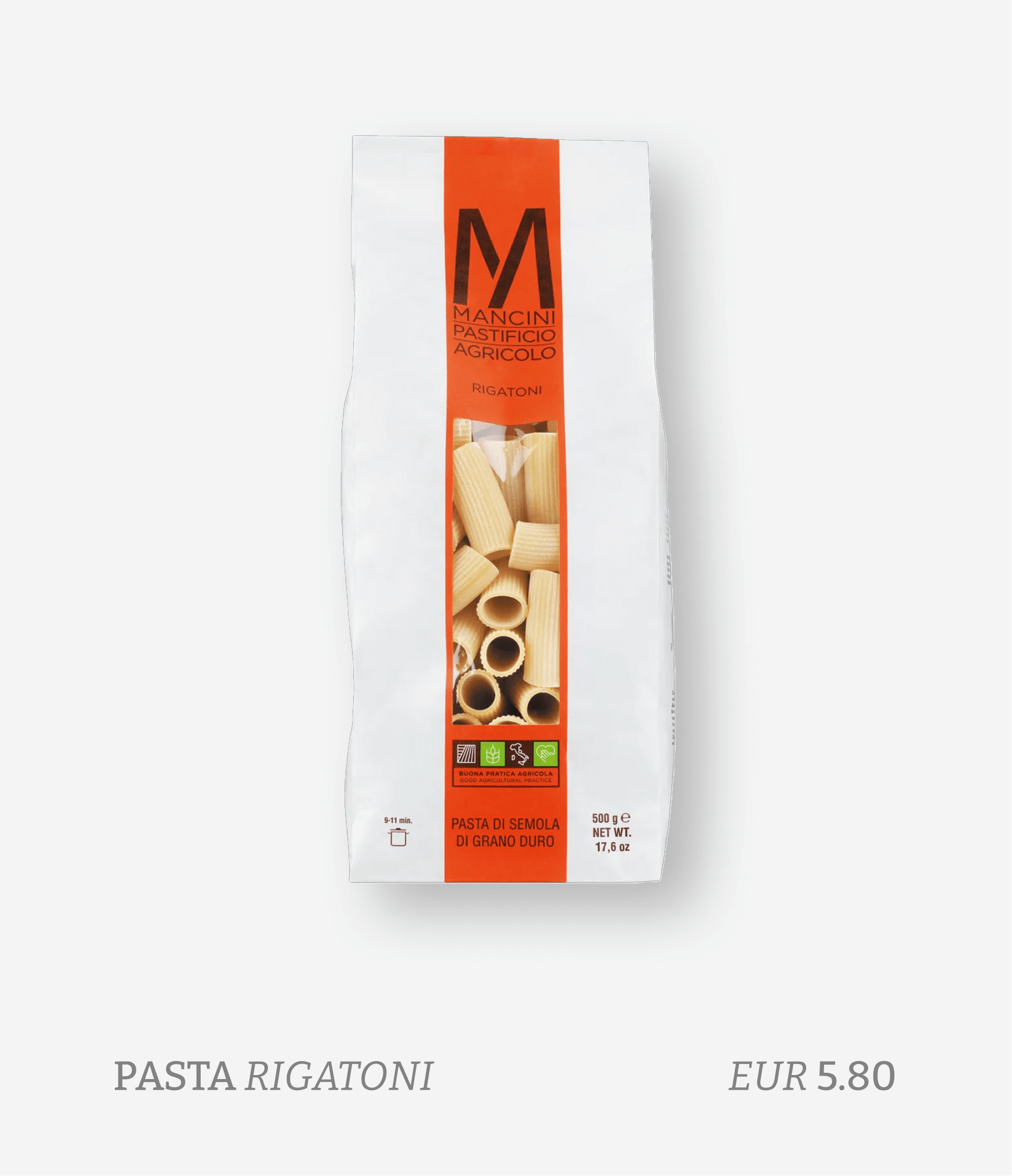 A package of Mancini pasta Rigatoni featuring a white background, red label, and transparent window showing tube-shaped pasta.