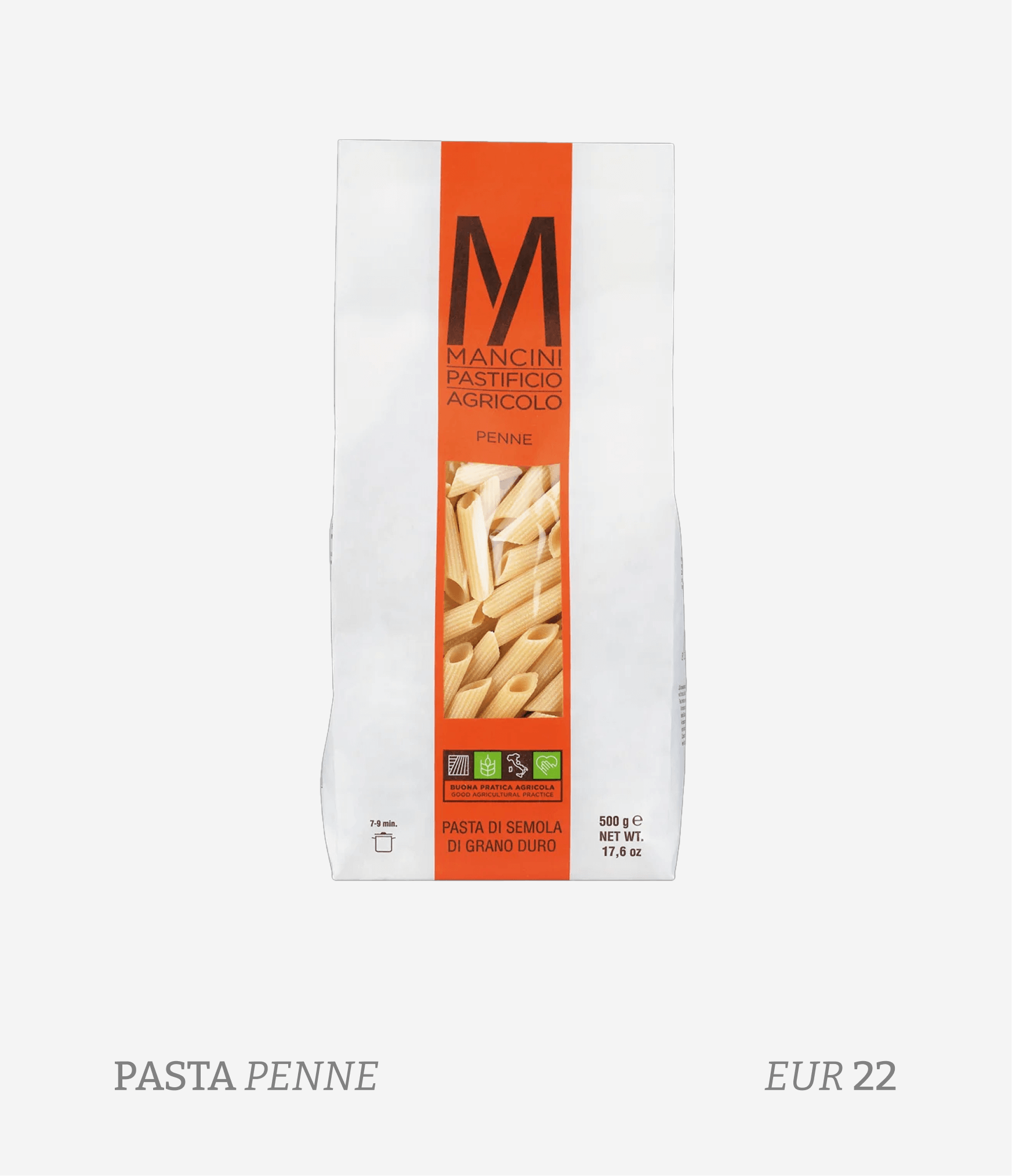 A package of Penne pasta with a white background and orange label. The label features a large black M logo and the words 'Mancini Pastificio Agricolo Penne,' along with images of the penne pasta and some symbols indicating agricultural practices. The package contains 500 grams of pasta.