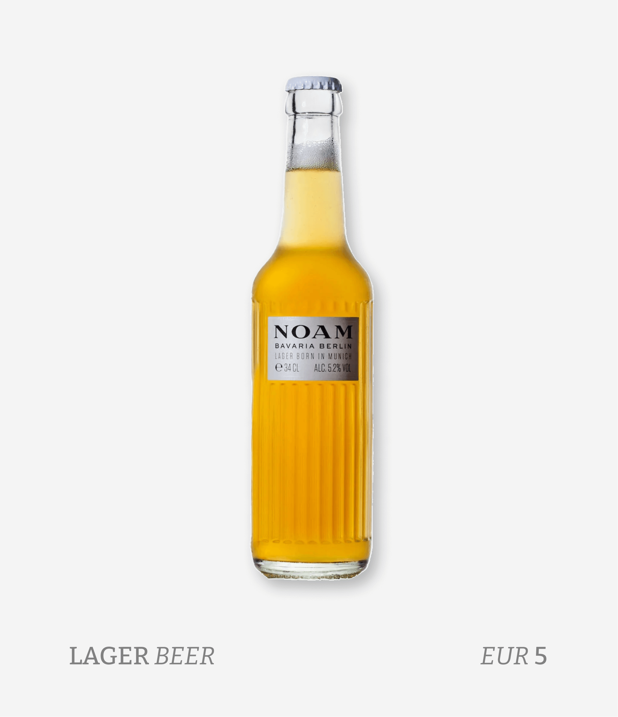 A bottle of lager beer with a white label that reads NOAM Bavaria Berlin, 5.2% alcohol, priced at EUR 5. The bottle is set against a plain white background, with the words "LAGER BEER" and the price "EUR 5" displayed beneath it.