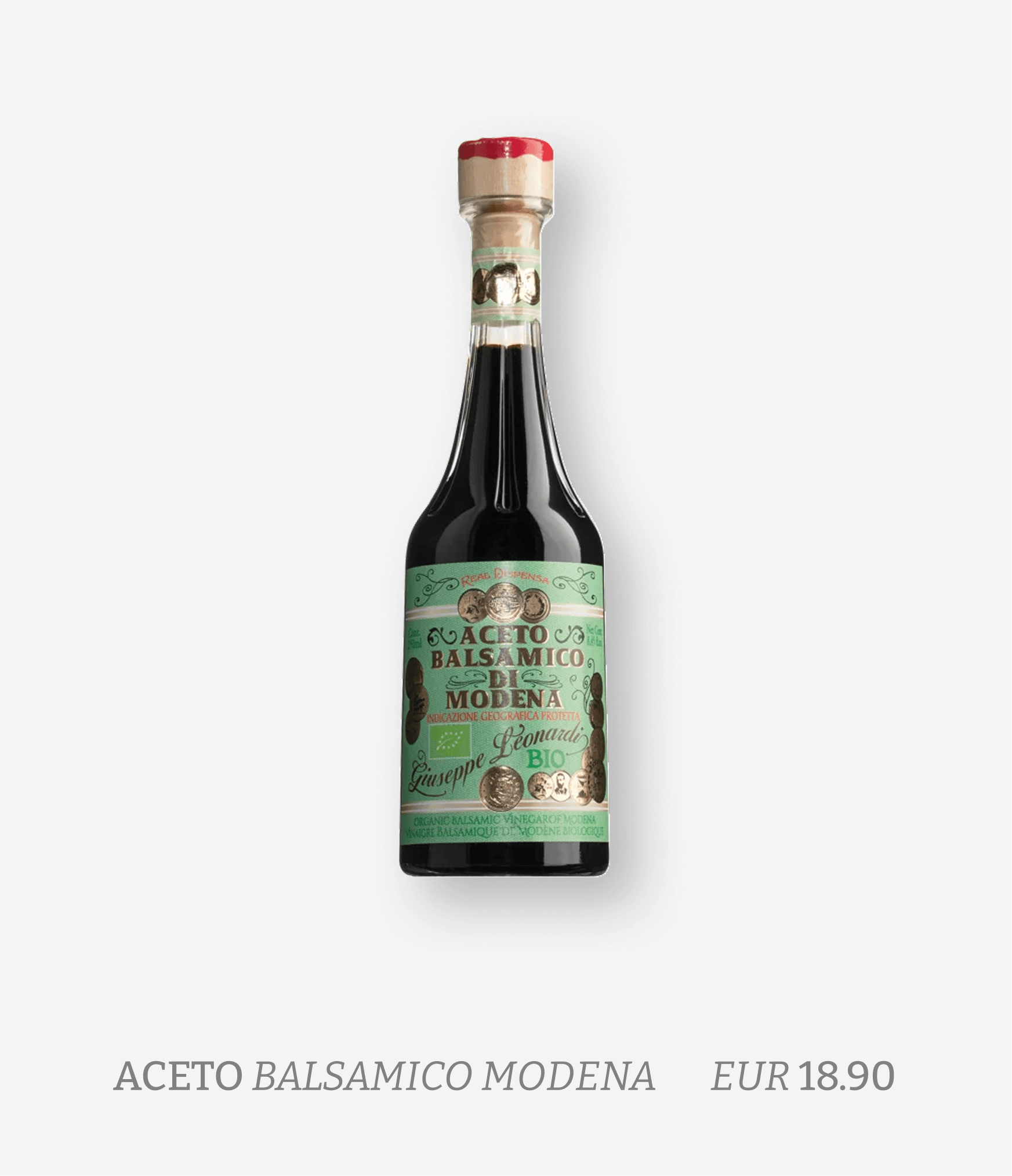Bottle of organic balsamic vinegar of Modena with a green label, black vinegar inside, priced at 18.90 euros.