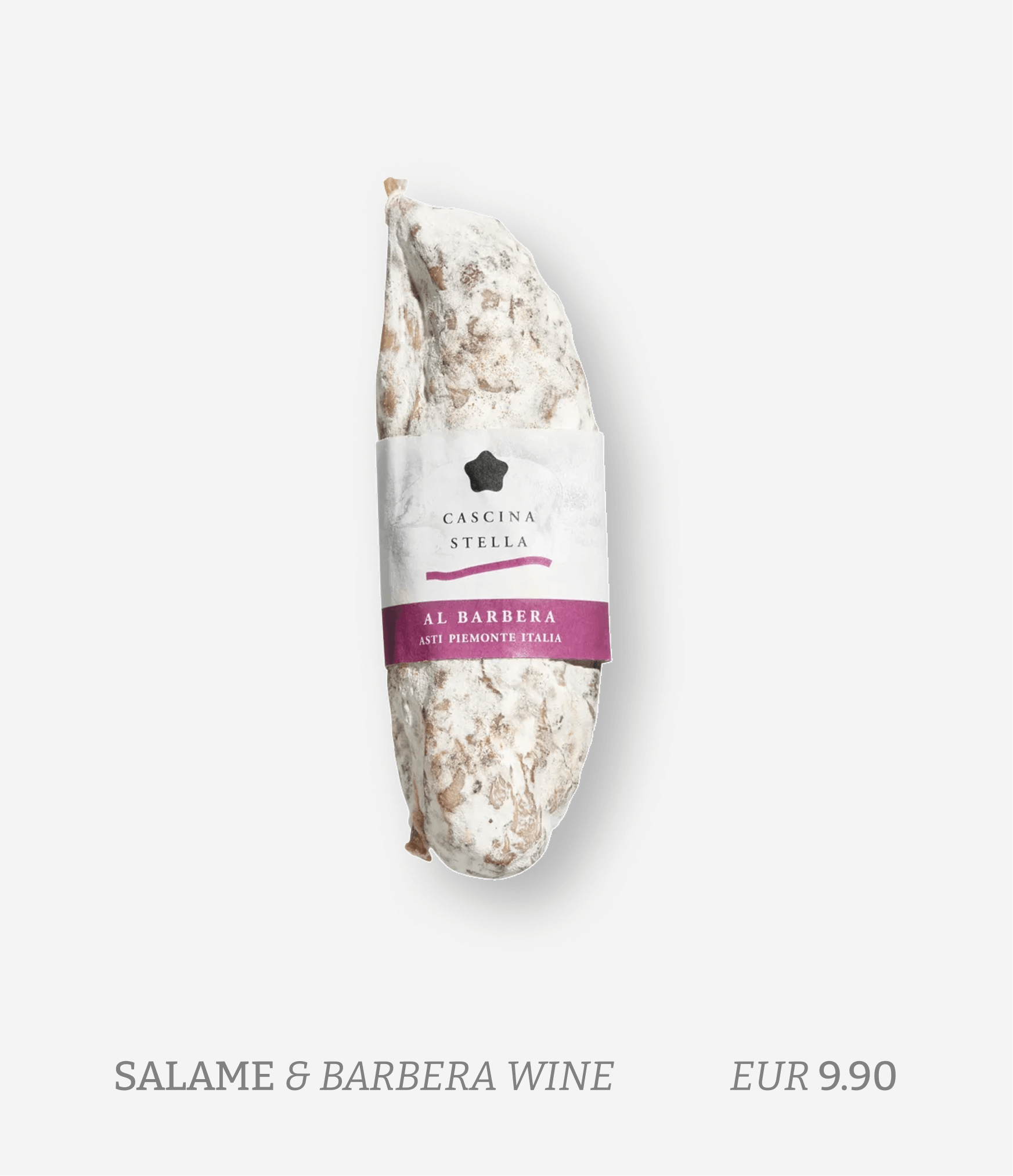 Italian salami with a white mold covering and a purple and white label that reads 'Cascina Stella, Al Barbera, Asti Piemonte Italia'.