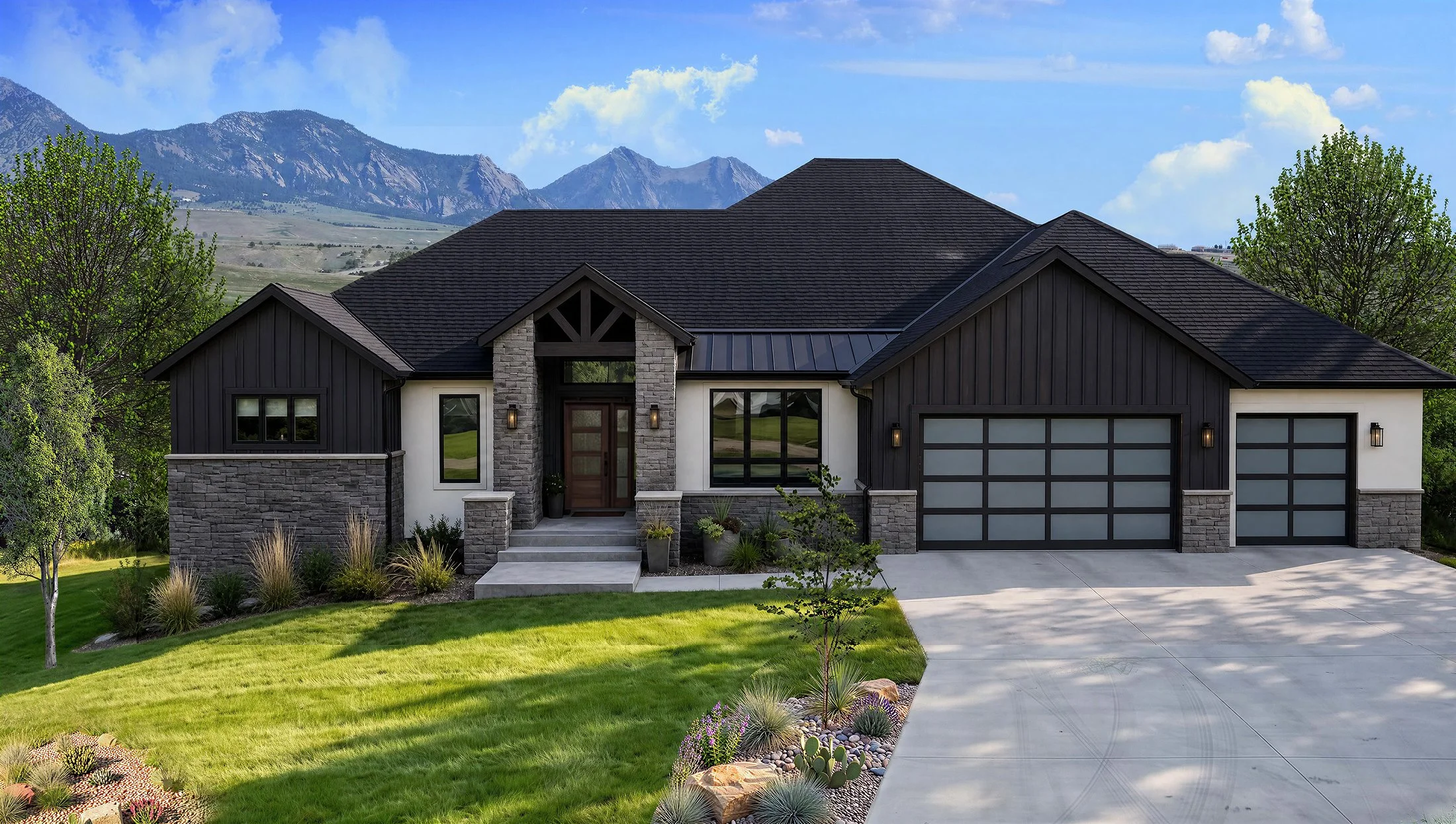 Modern house with black and white exterior, stone accents, and a three-car garage, set against a backdrop of mountains and blue sky.