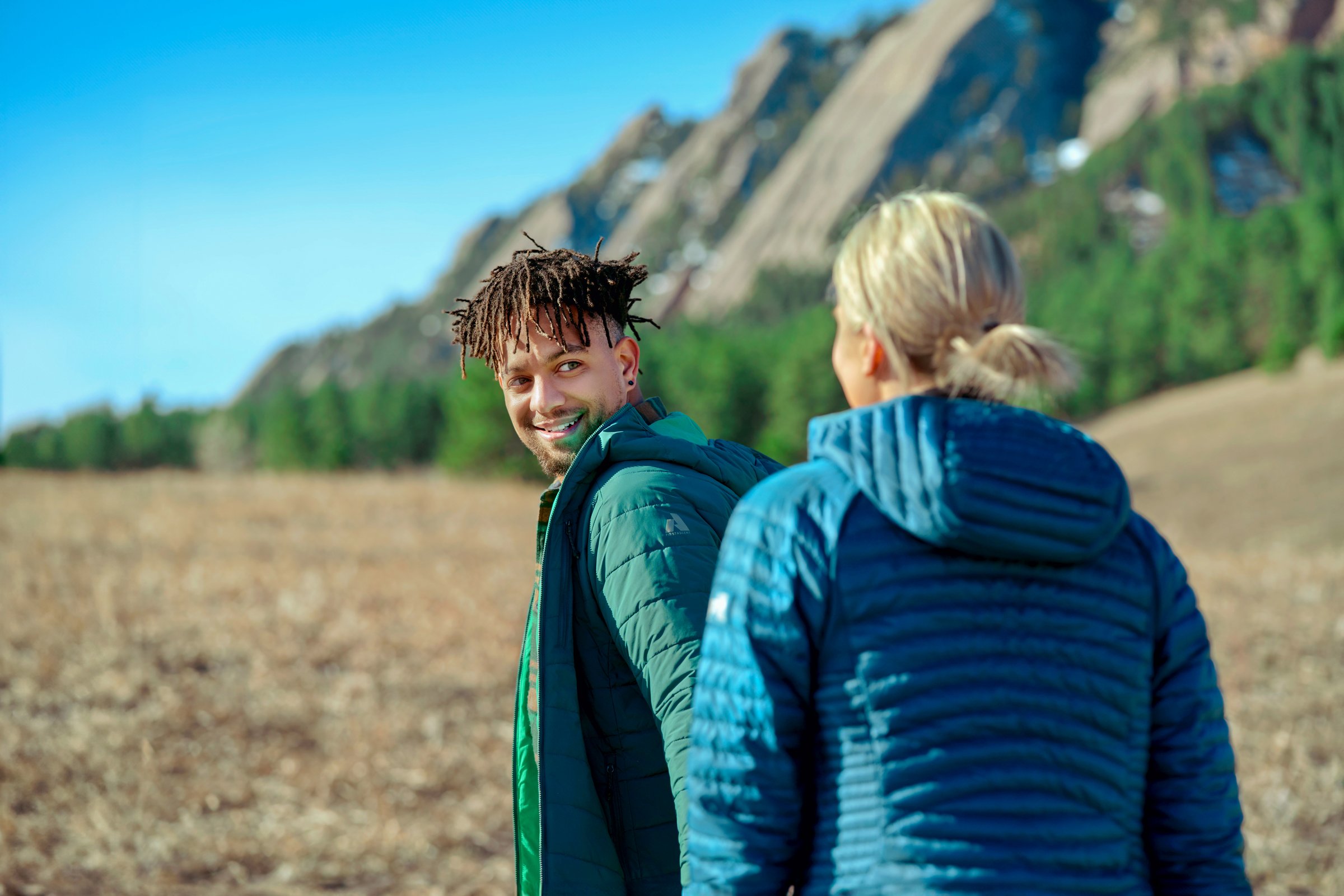 Couple wearing Eddie Bauer Down Hooded Jacket at Chautauqua Park.