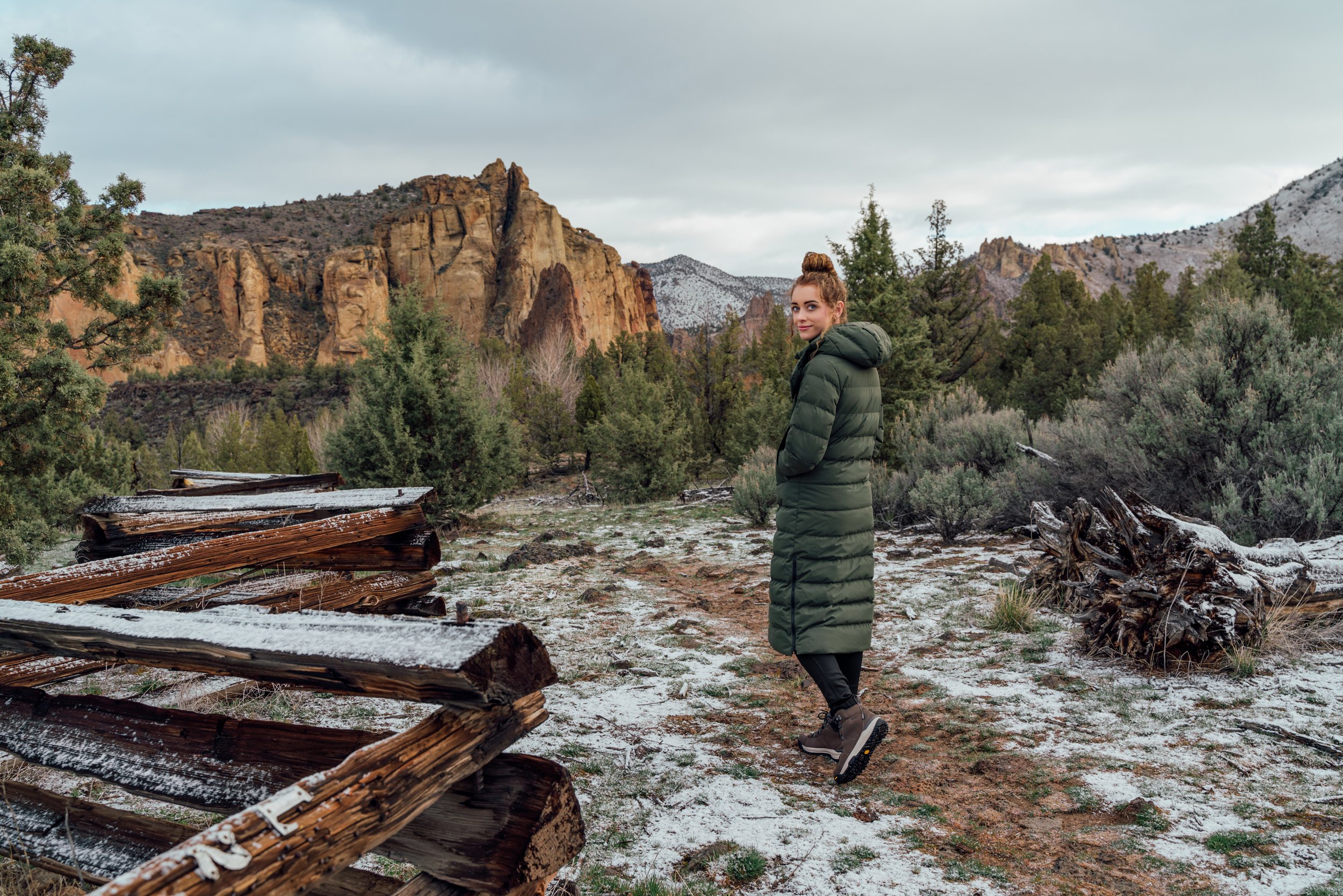 Girl Walks Frosted Trail Near Smith Rock State Park Showcasing Outdoor Research Parka.