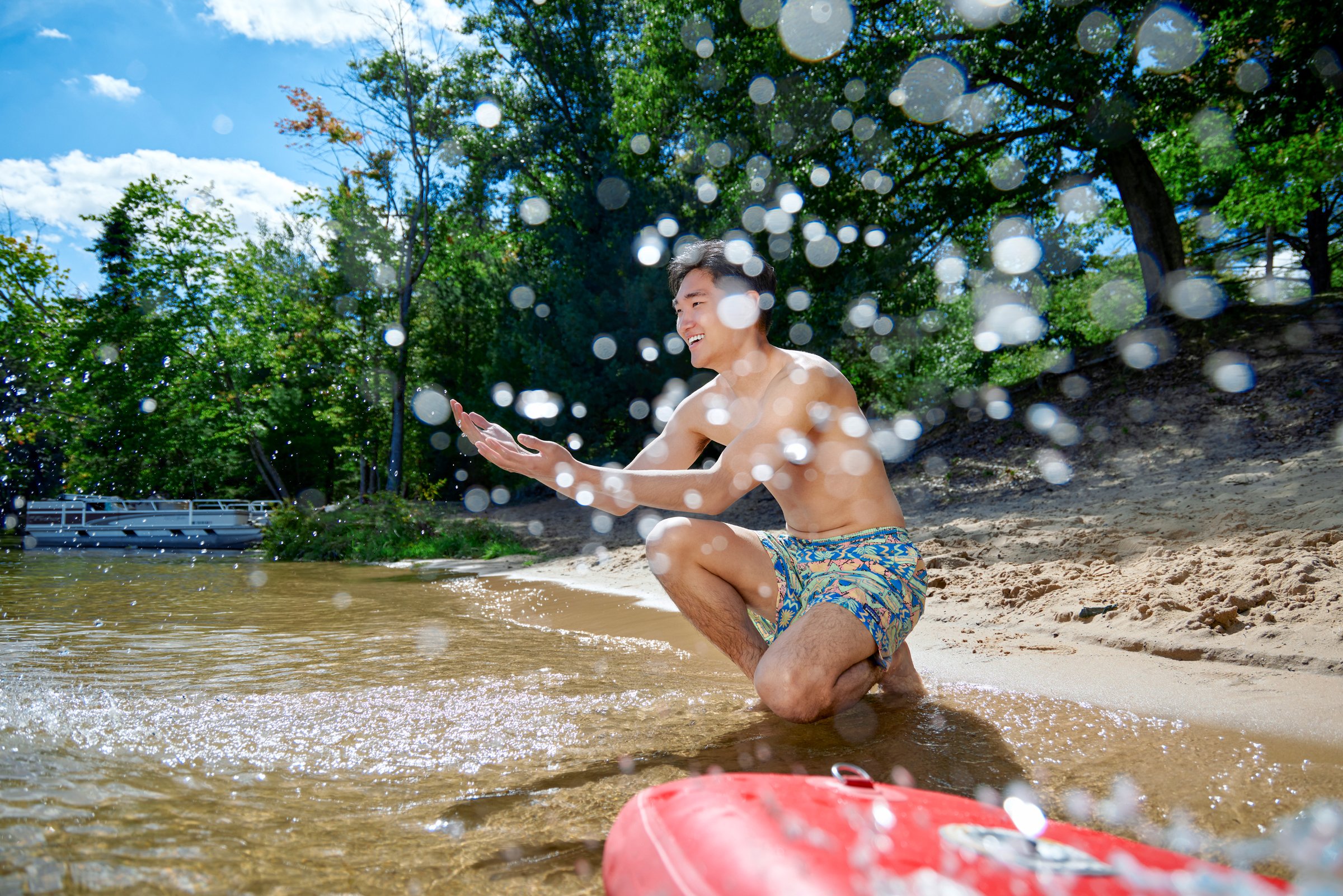 Man Splashes Waves Patagonia Men's Baggies.