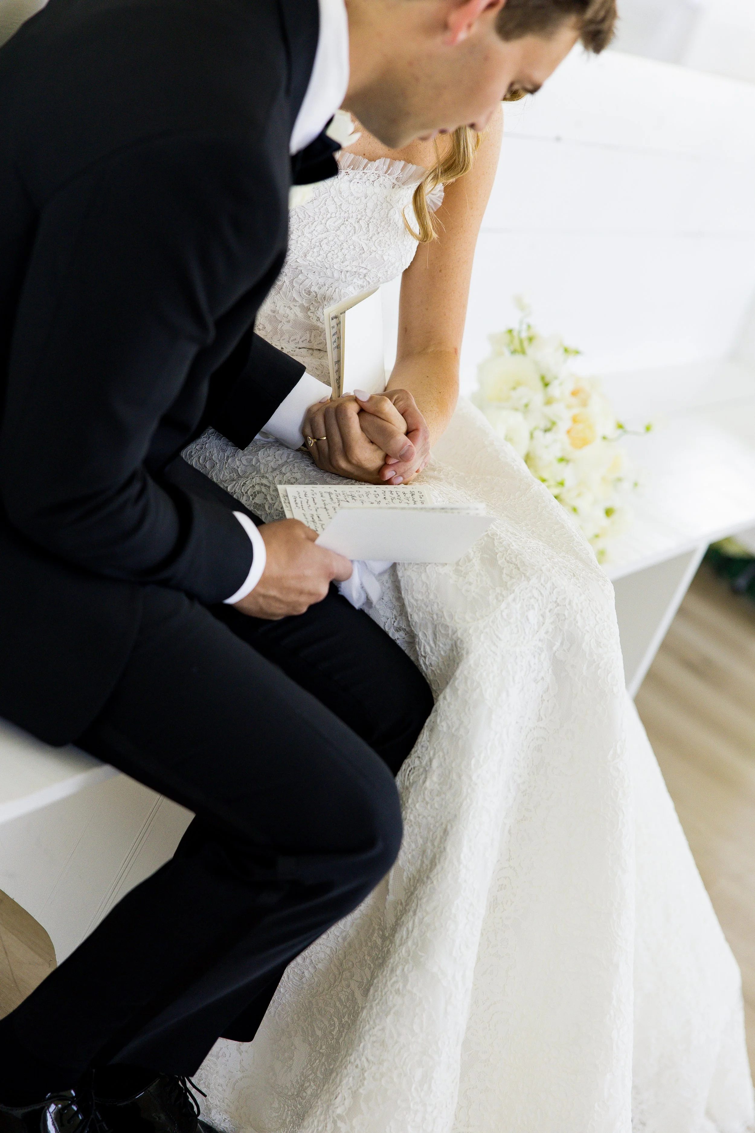Couple praying together after first look and private vows at their wedding in the Dallas Texas area.