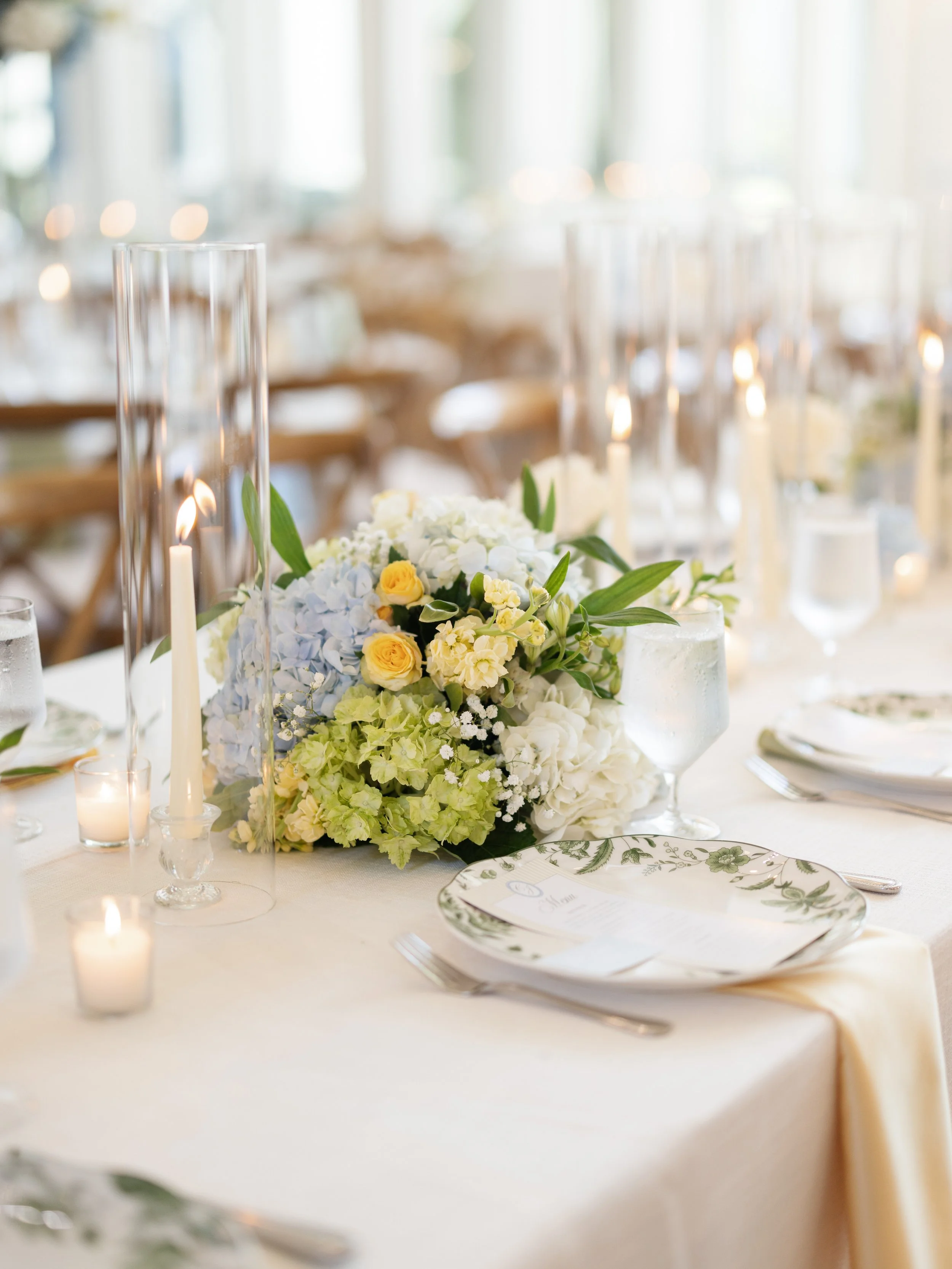 blue green and yellow floral wedding centerpiece for wedding at The French Farmhouse in Collinsville, Texas.