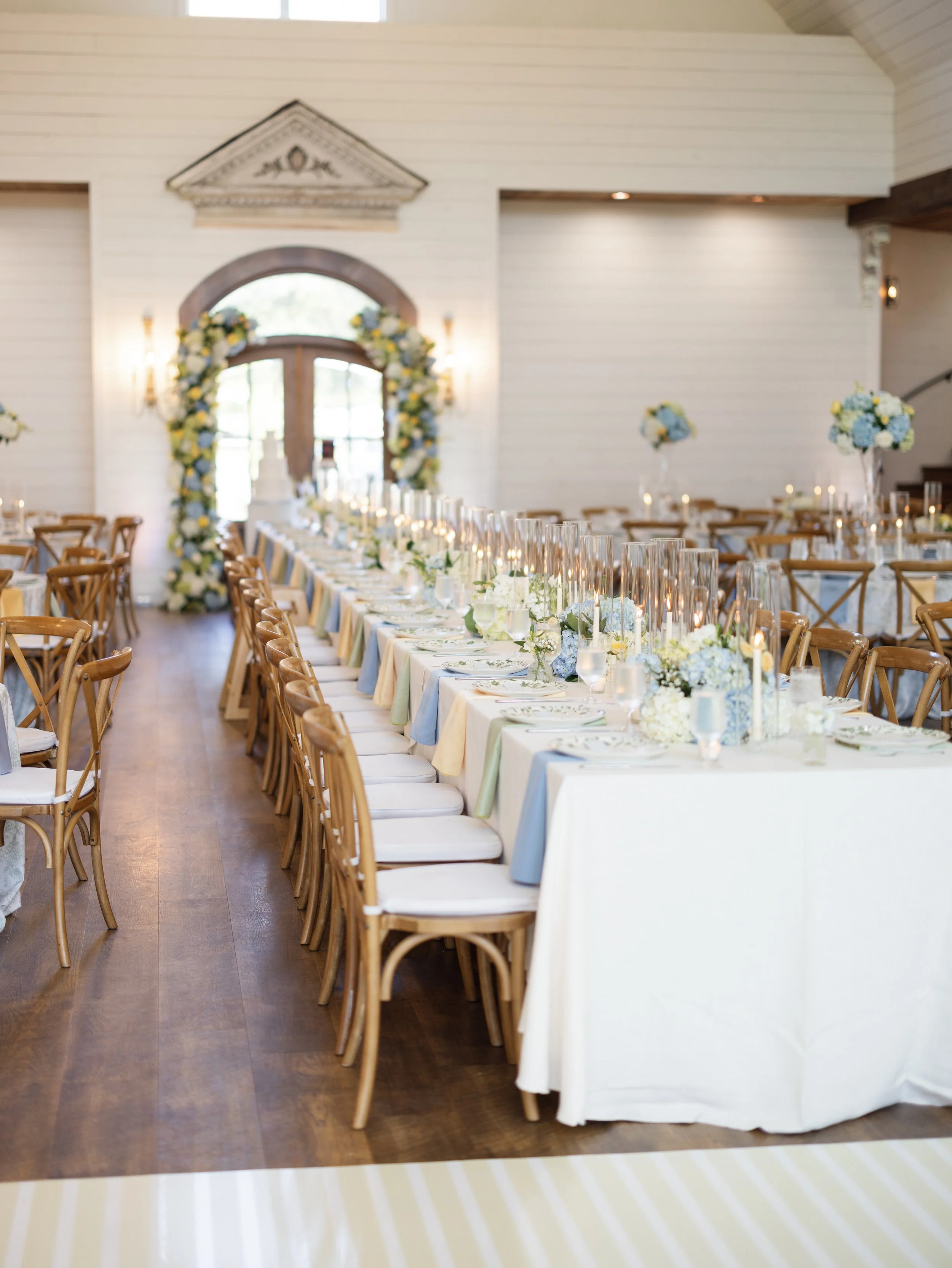 Luxury wedding reception with custom décor, candlelight, and elegant floral design.