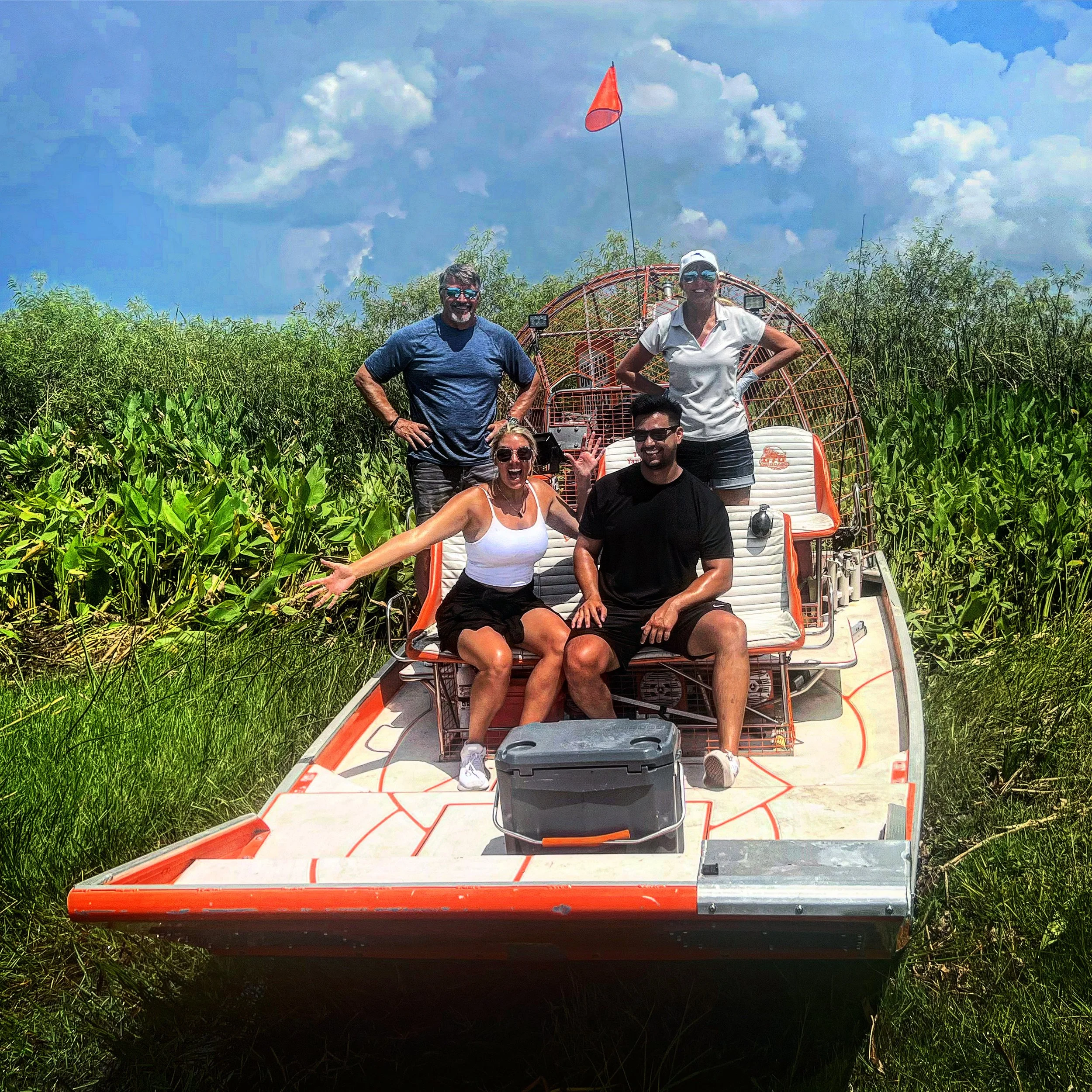 Guests aboard an airboat exploring the Florida Everglades