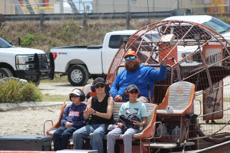 Family preparing for an airboat tour at the departure area