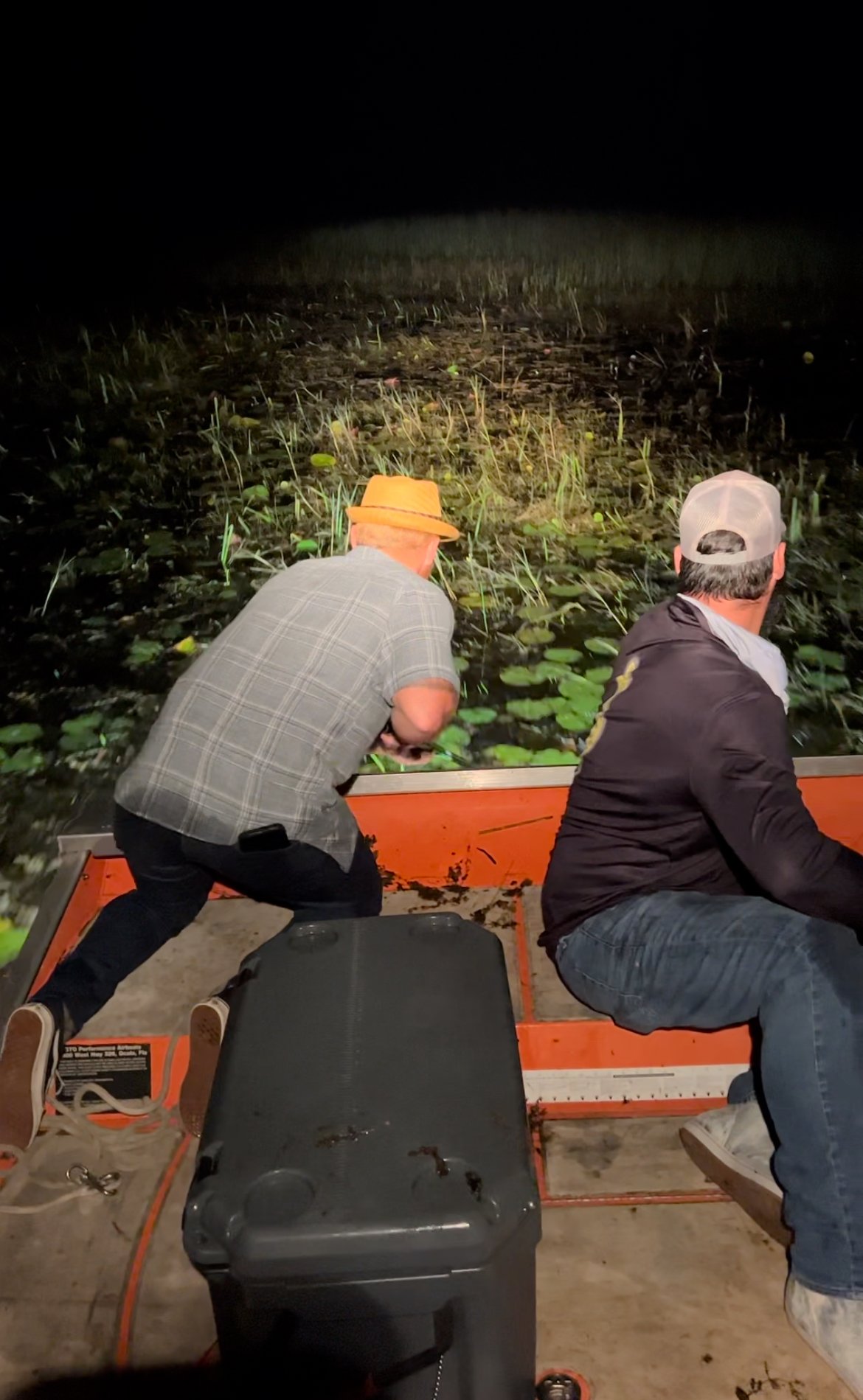 Two guests aboard an airboat during an Everglades night outing