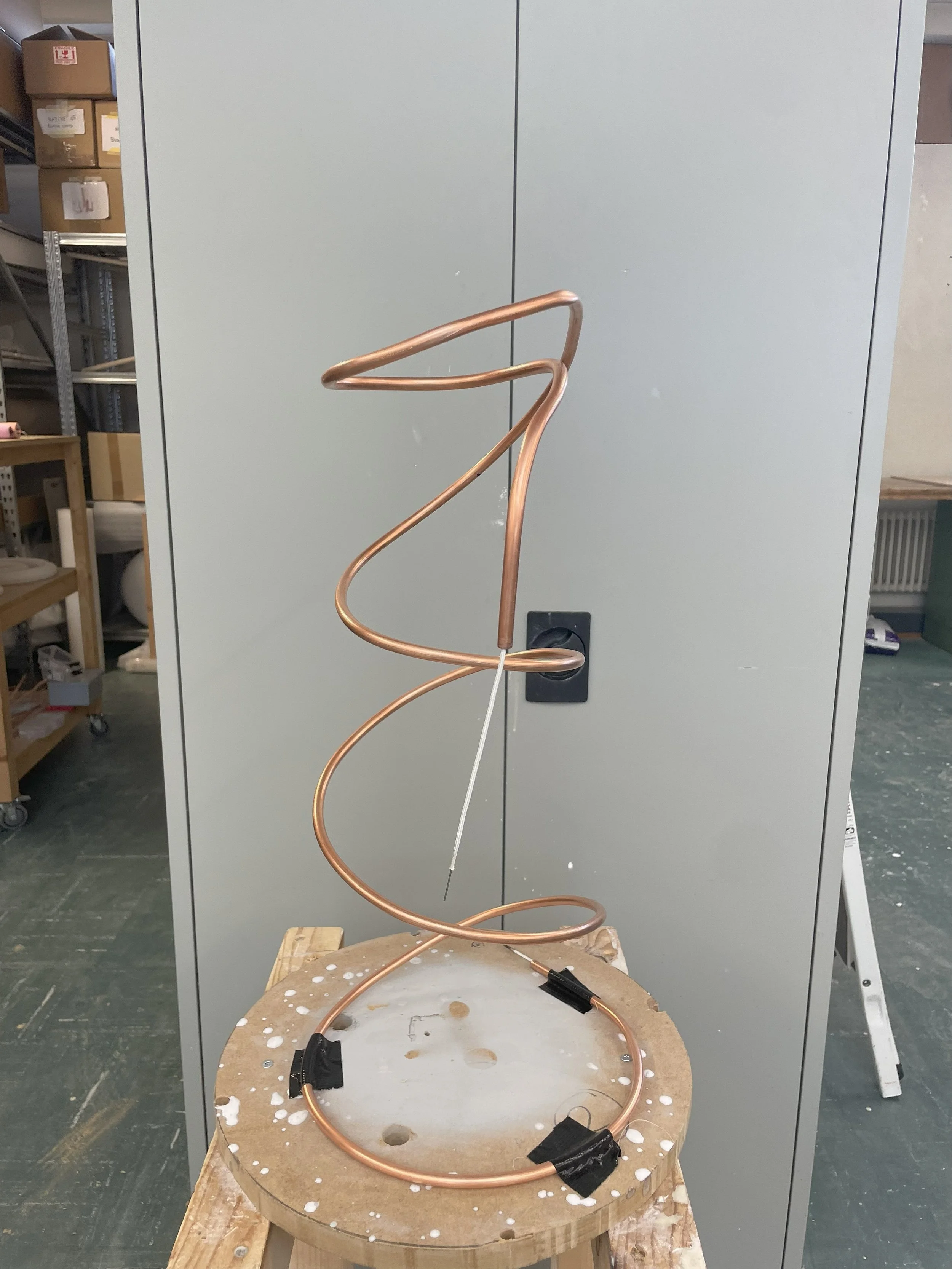 One single copper tube bent by hand.