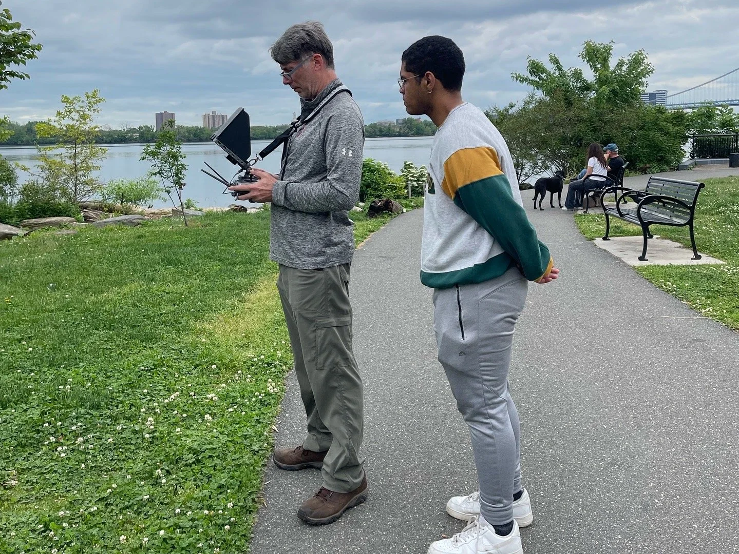Eric LaCasse and Nikai Morales filming drone shots in East Philadelphia.