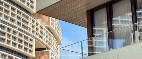 Modern architectural design with large windows and balconies