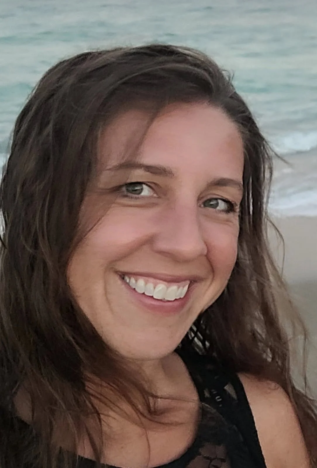 Woman at the beach smiling