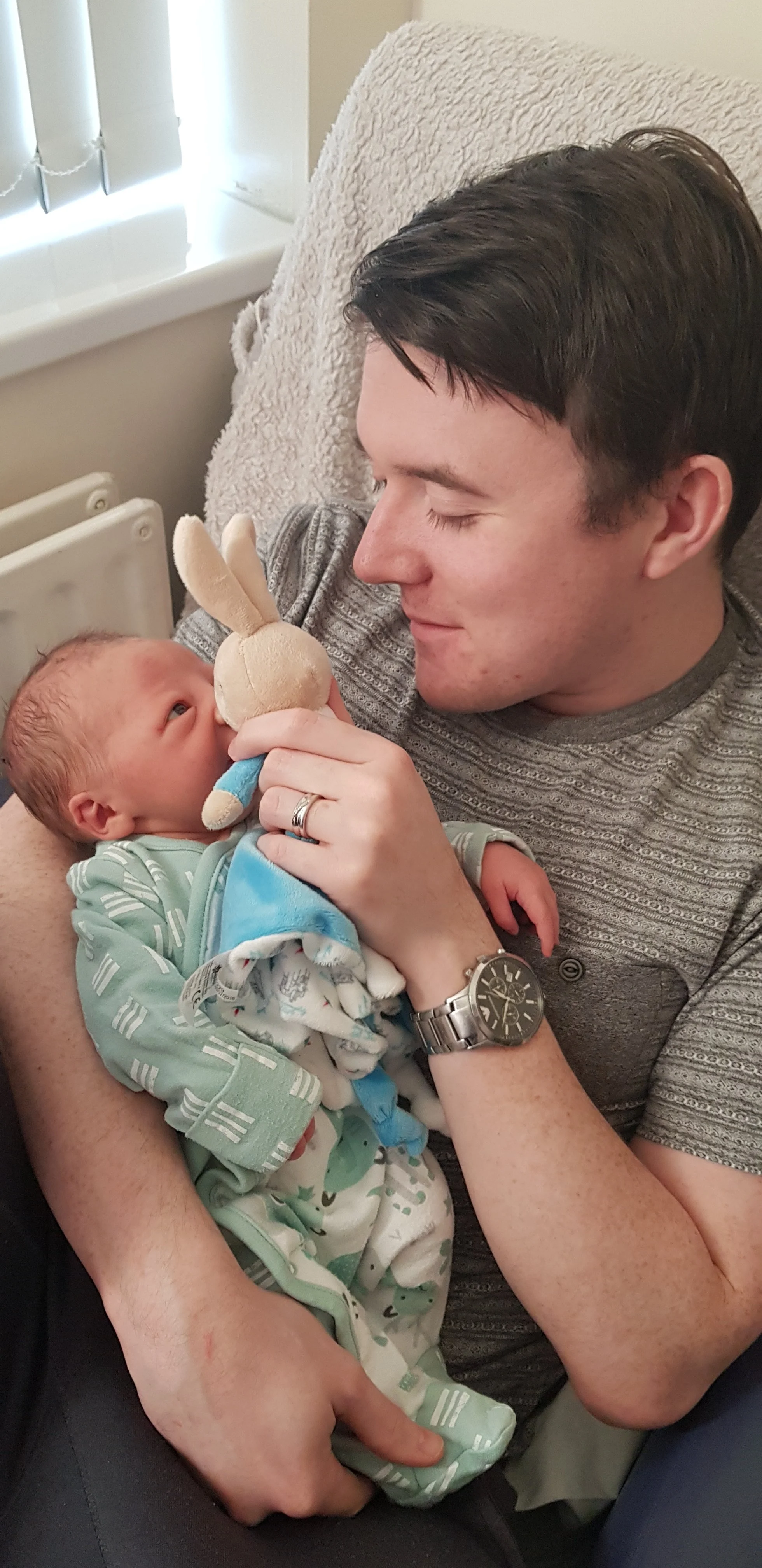 Matthew bonding with Zachary after he was born.jpg