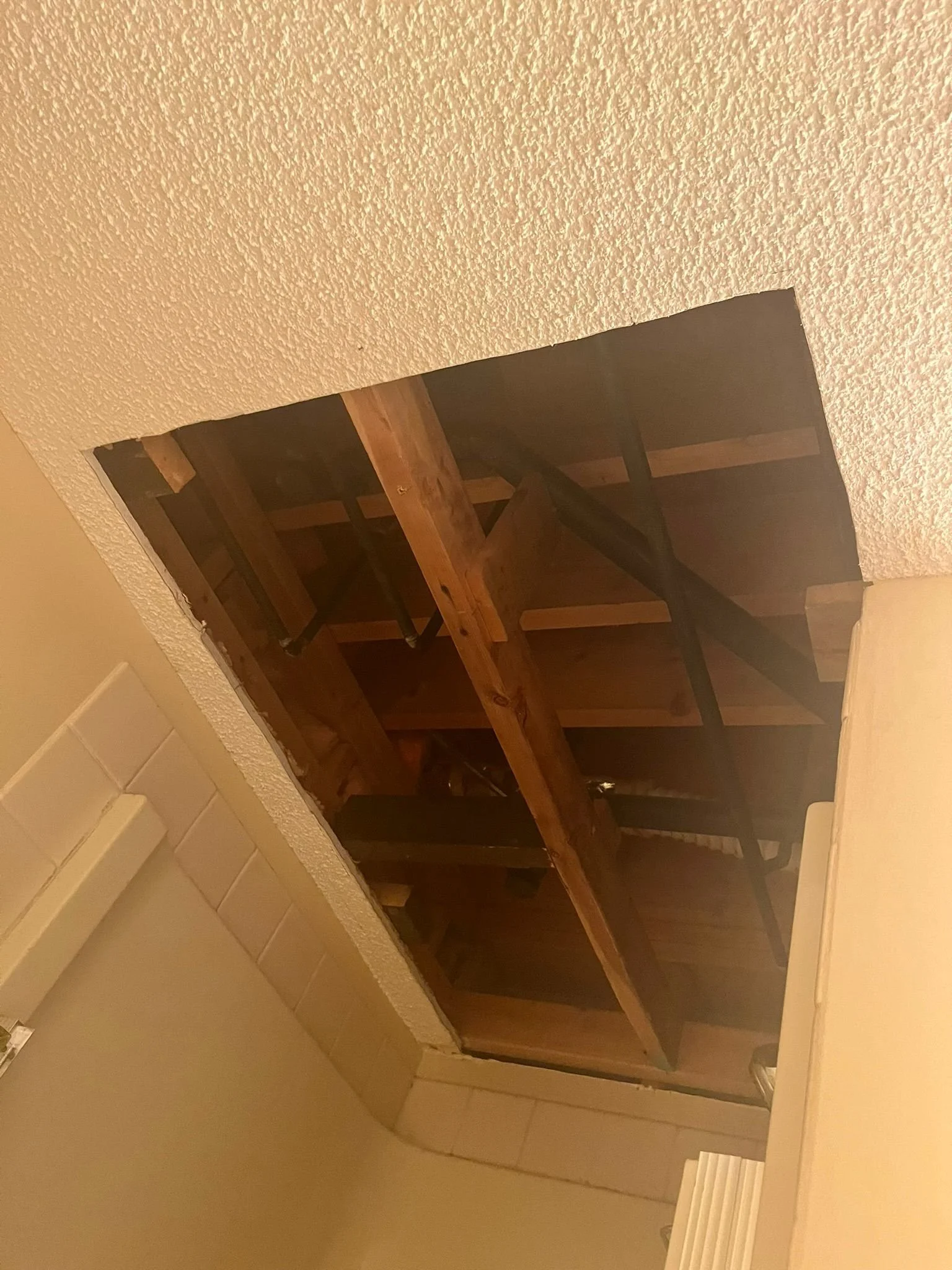 Ceiling Patch Repair :When this family moved into their home, this hole was patched in poorly, so we fixed it up and smoothed it over.
