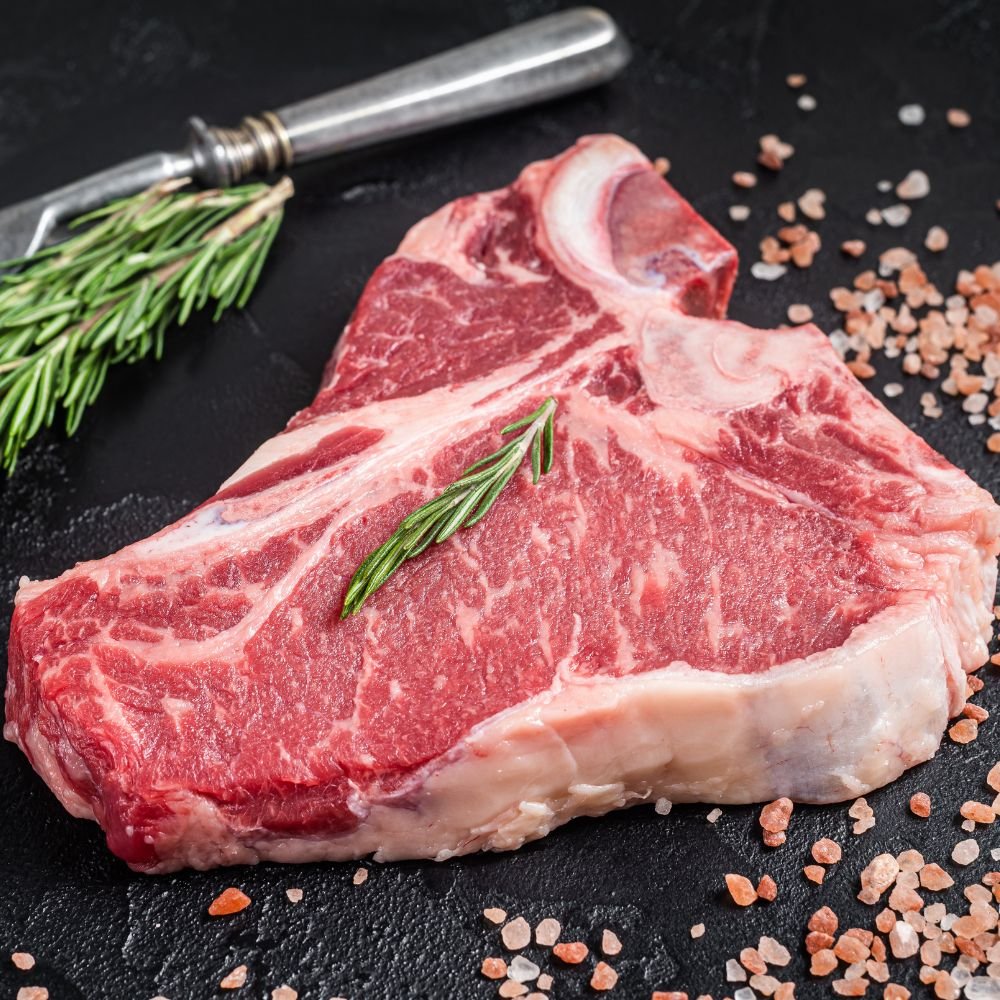 Raw T-bone steak with rosemary and pink salt from Dry Creek Pastures beef shares