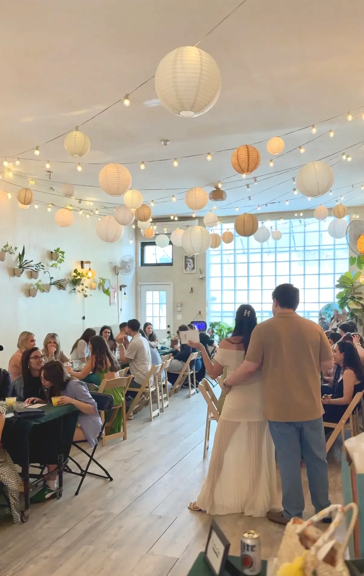 A baby shower at bat haus in brooklyn with hosts and guests playing a baby shower game