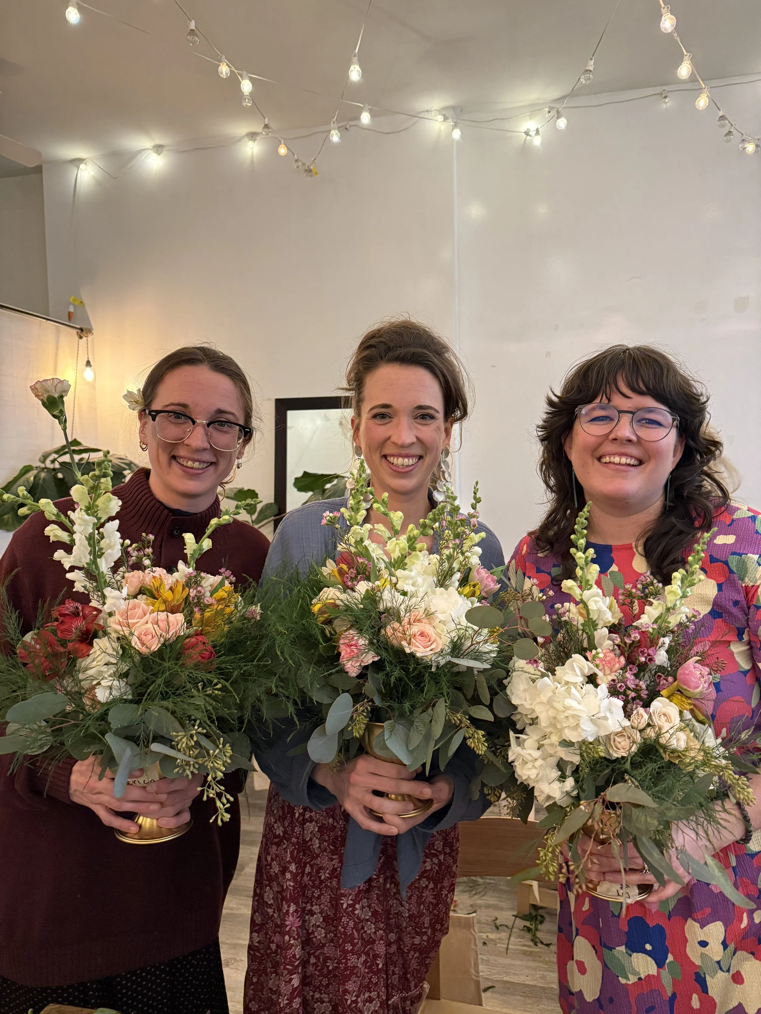 birthday floral workshop brooklyn guests holding their flower arrangements during a private celebration at bat haus