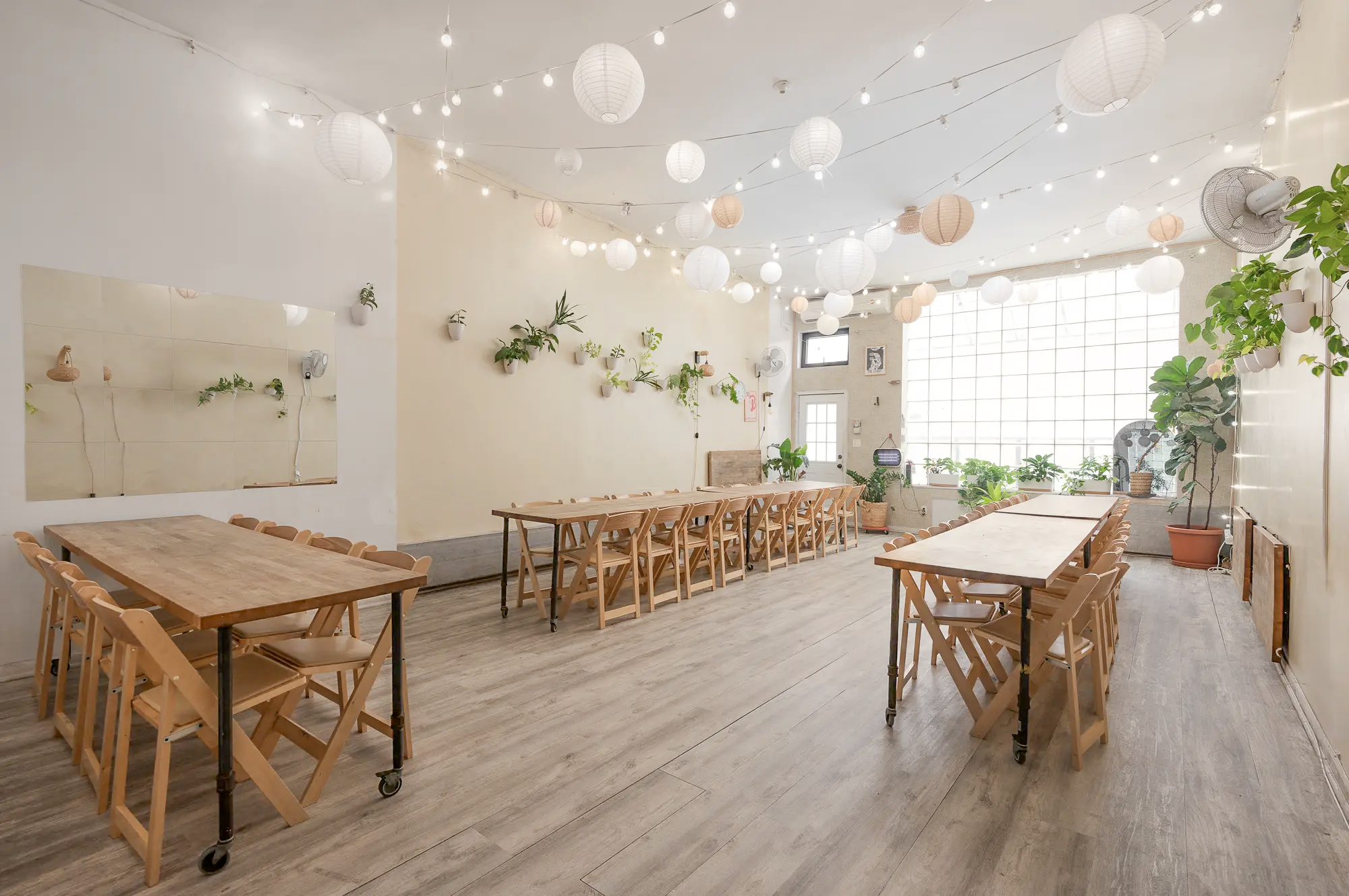 Beautiful brooklyn event space bat haus, huge window wall with sun light coming into the main space.