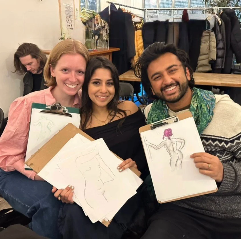 Friends at Bat Haus Drink n Draw showing colorful figure sketches during a live model drawing session, a popular creative night and art event in Brooklyn