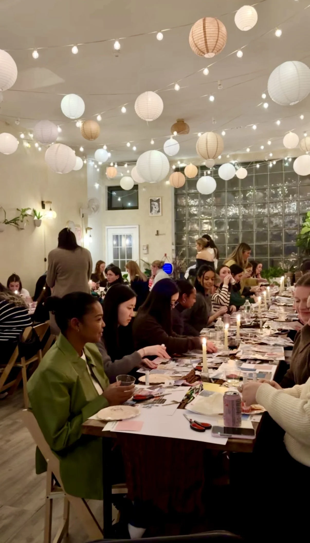 Corporate team off site dinner and workshop at Bat Haus Brooklyn event space with long tables under string lights in Williamsburg NYC