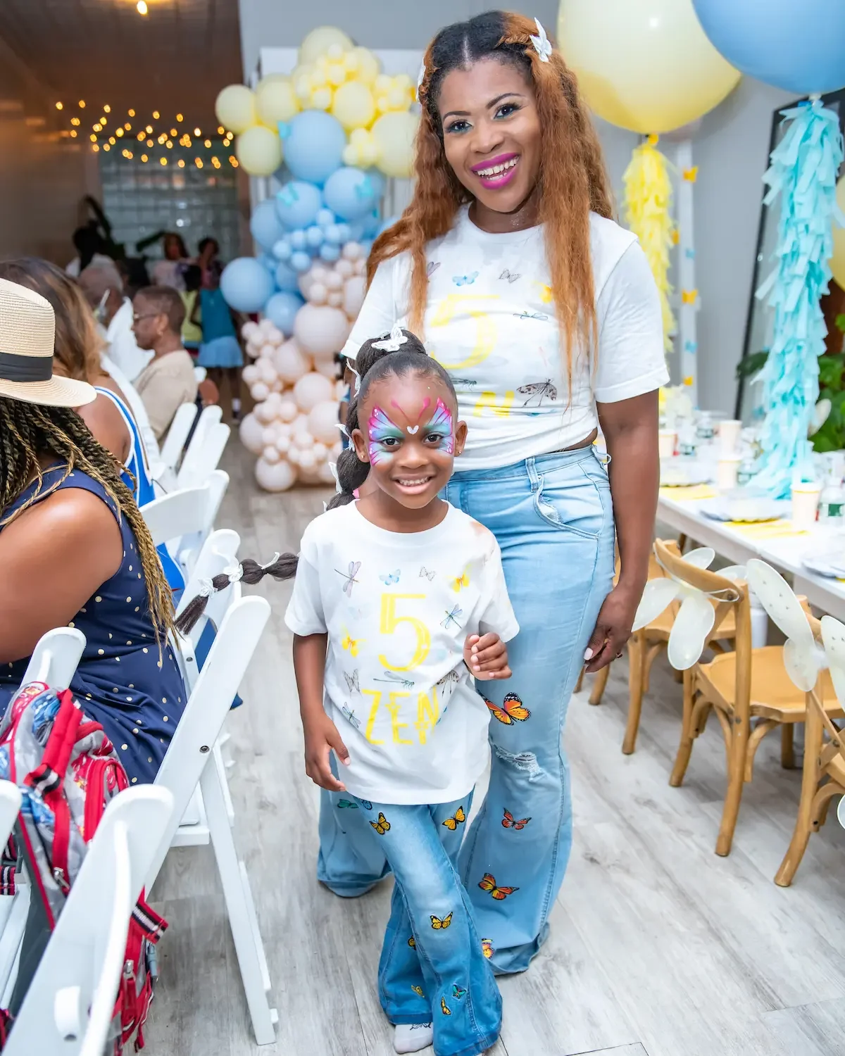 Kids birthday party space in Brooklyn at Bat Haus with children and parents arriving at a decorated birthday setup with balloon arch and tables ready for the party.