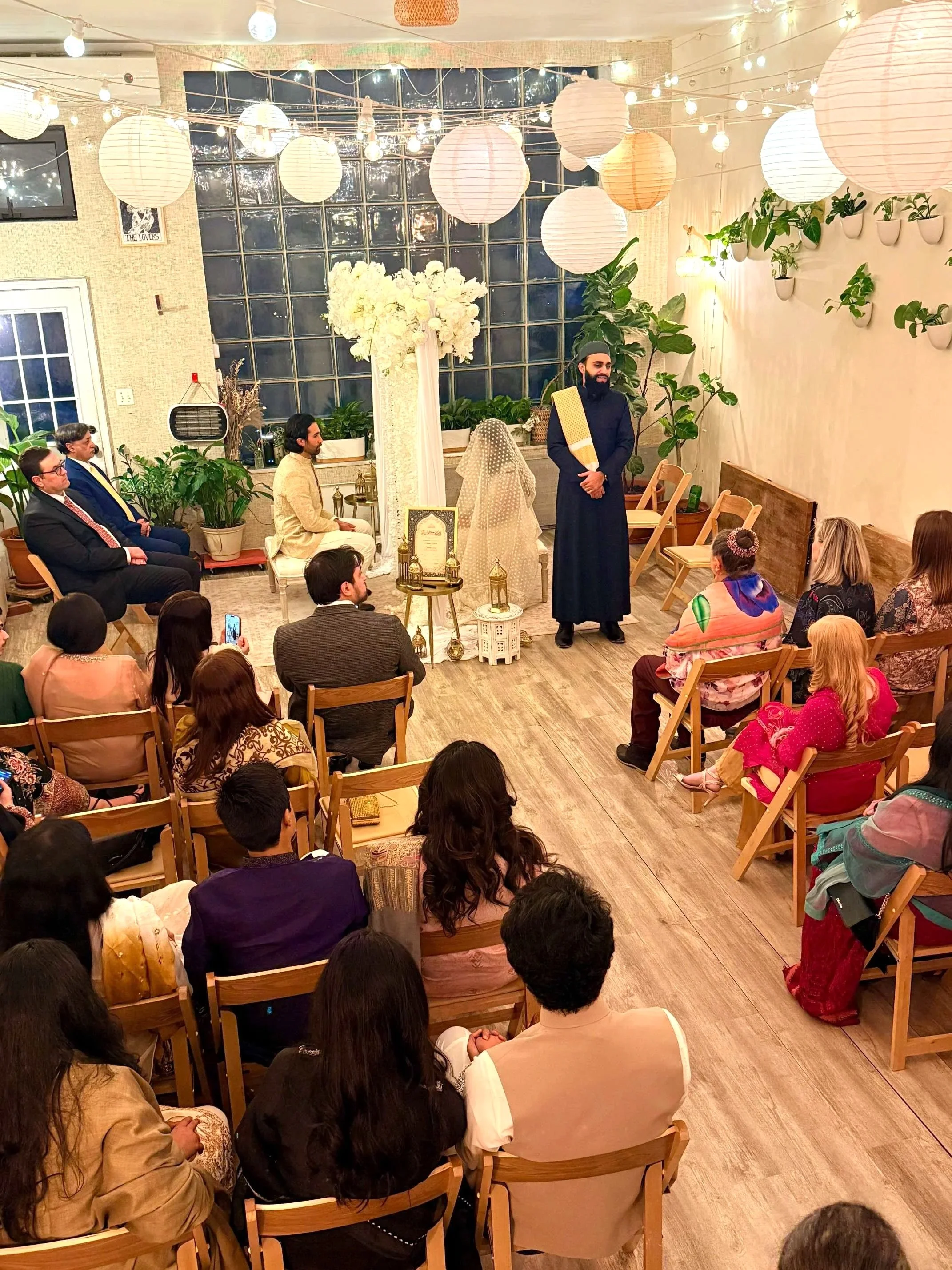 Nikah wedding ceremony at Bat Haus in Brooklyn, featuring an intimate indoor setup with seated guests, floral décor, and a warm, light-filled space for a meaningful Muslim marriage celebration.