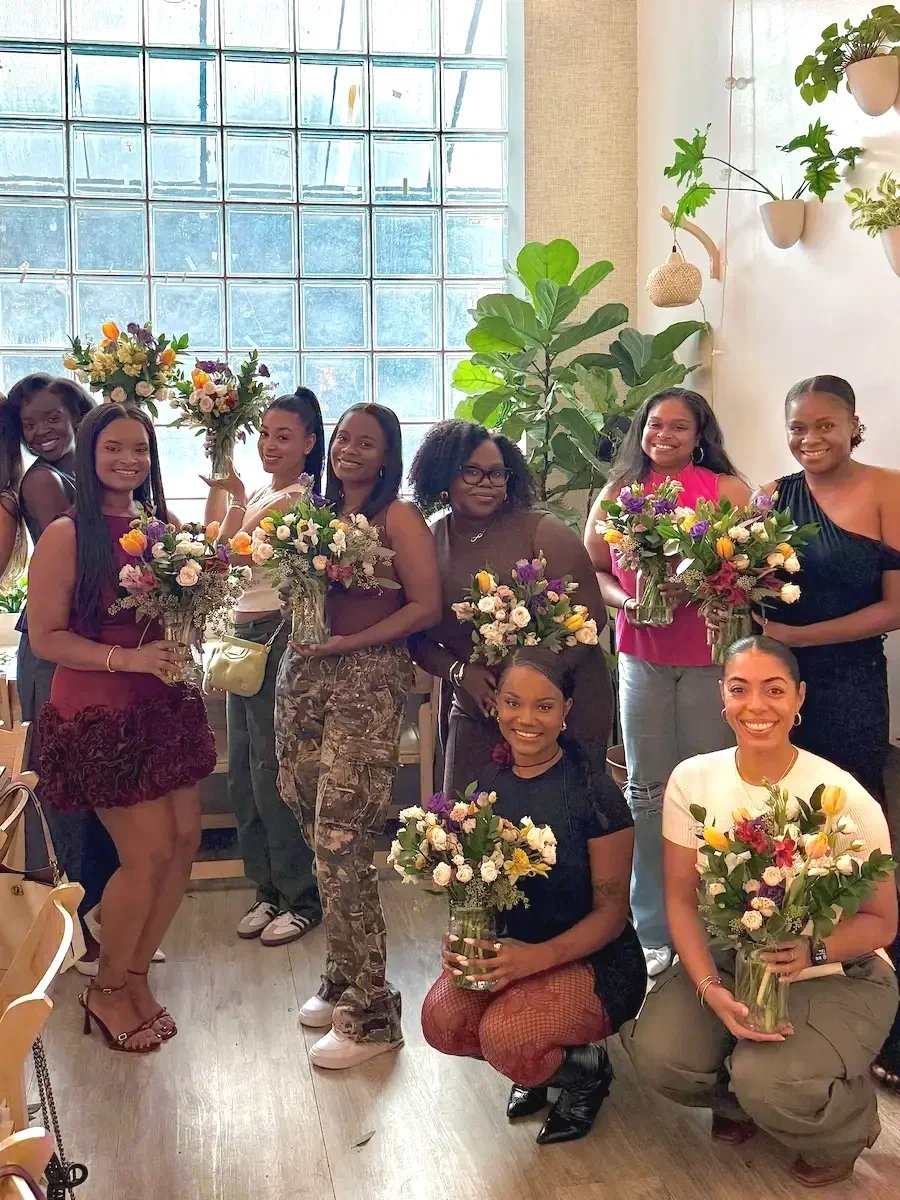 birthday floral workshop brooklyn guests holding their flower arrangements during a private birthday celebration at bat haus
