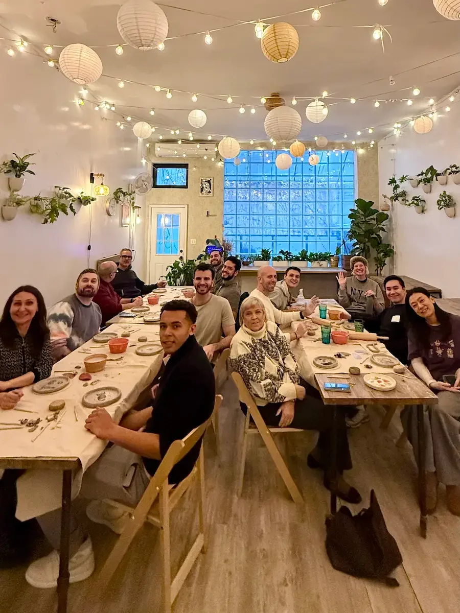 corporate team bonding pottery class brooklyn coworkers making ceramics together during a group workshop at bat haus