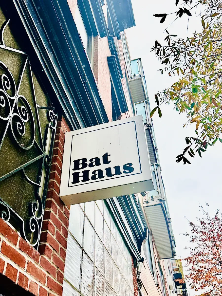 Exterior Bat Haus sign mounted on a brick building in Williamsburg, Brooklyn, marking the entrance to the event space.
