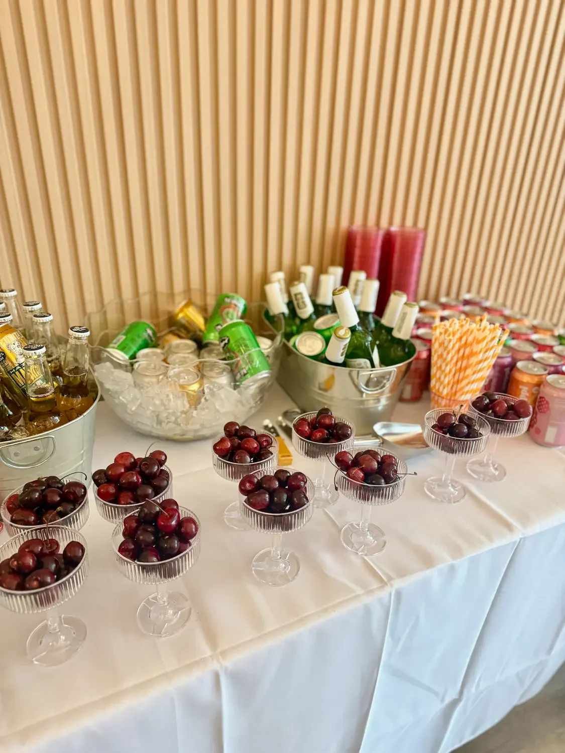 A BYO drinks and dessert table with champagne on ice at an engagement party at Bat Haus in Brooklyn.