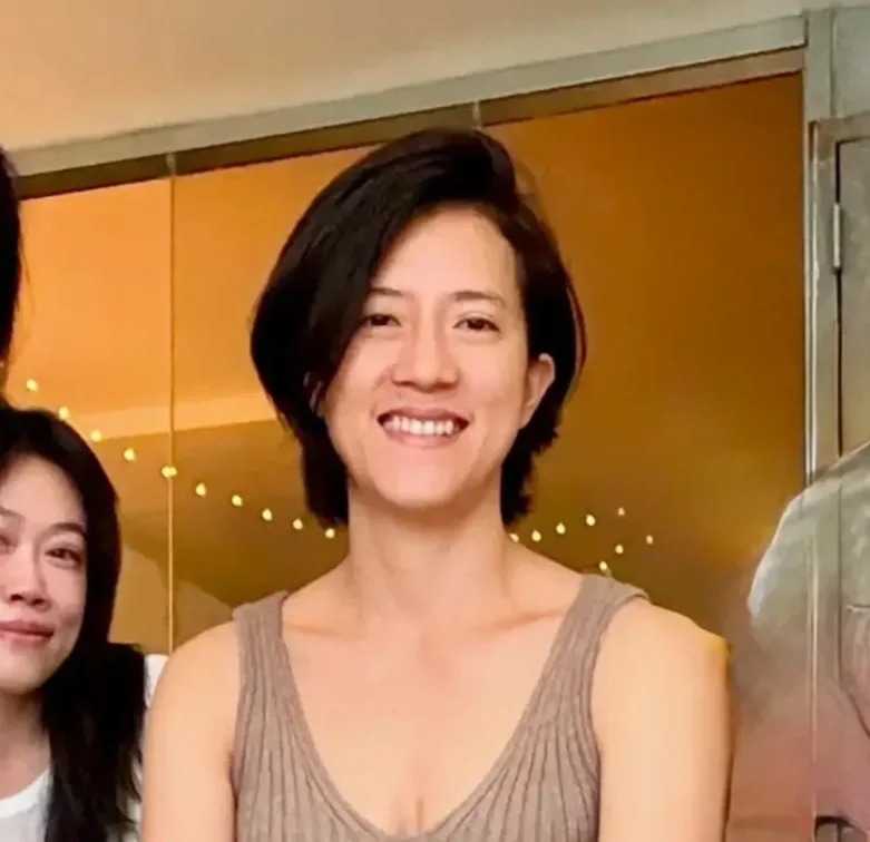 Portrait of Natalie Chan, founder of Bat Haus in Williamsburg Brooklyn, smiling in the light-filled event space she established in 2012.