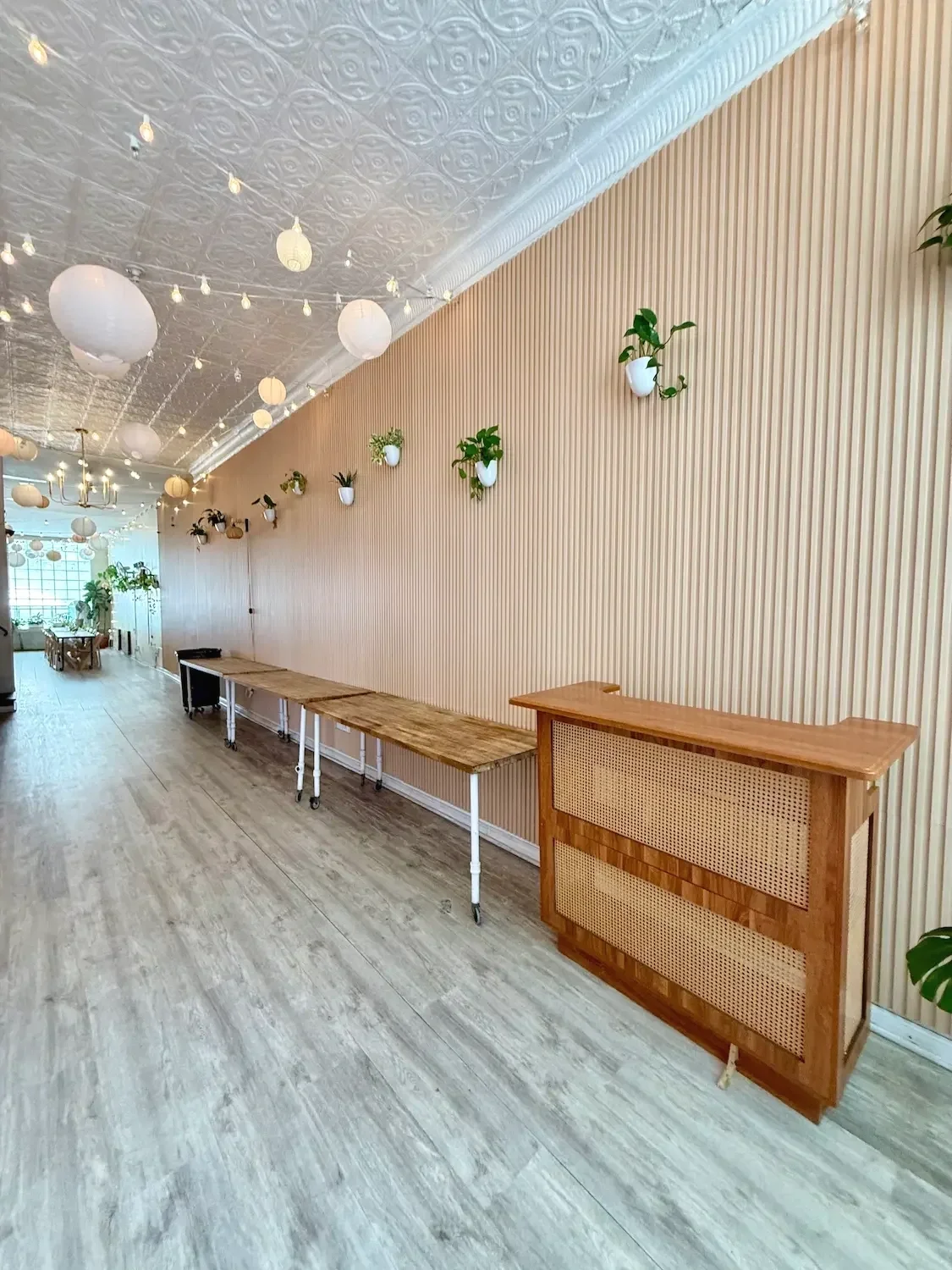 Bar and buffet tables along a wood slat wall at Bat Haus event venue in Williamsburg, Brooklyn