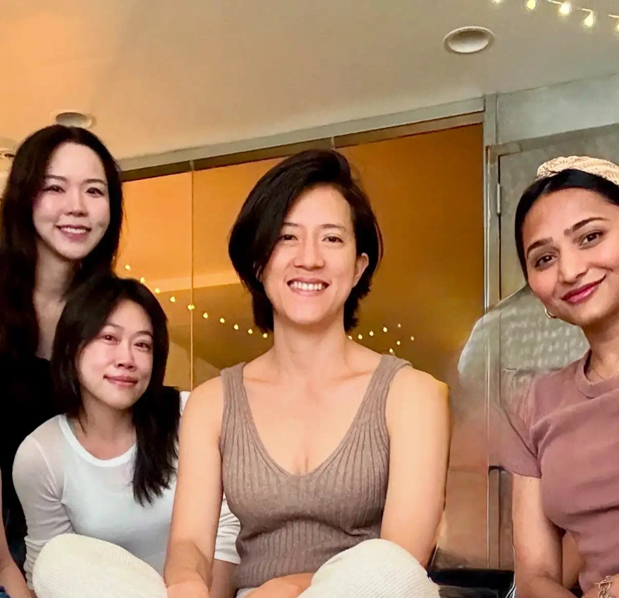 Natalie Chan, sound bath instructor at Bat Haus in Brooklyn, seated with participants during a guided private group session in the Williamsburg event space.