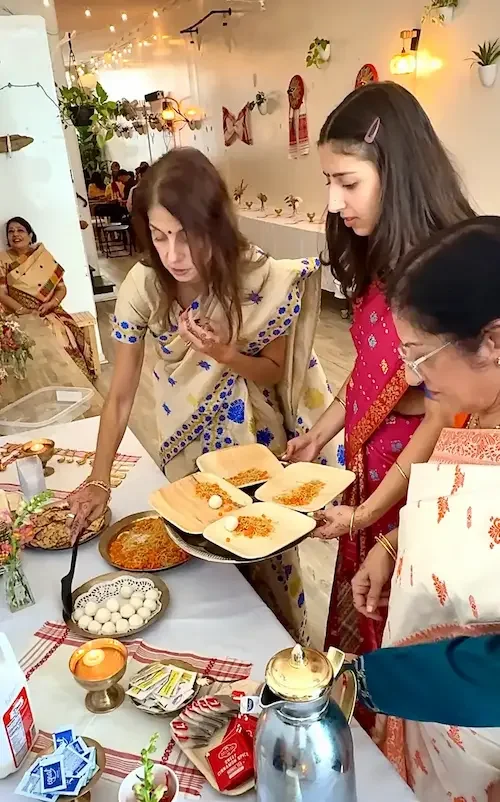 joron engagement ceremony celebration at Bat Haus Brooklyn with family serving traditional food during a Bengali cultural engagement party gathering
