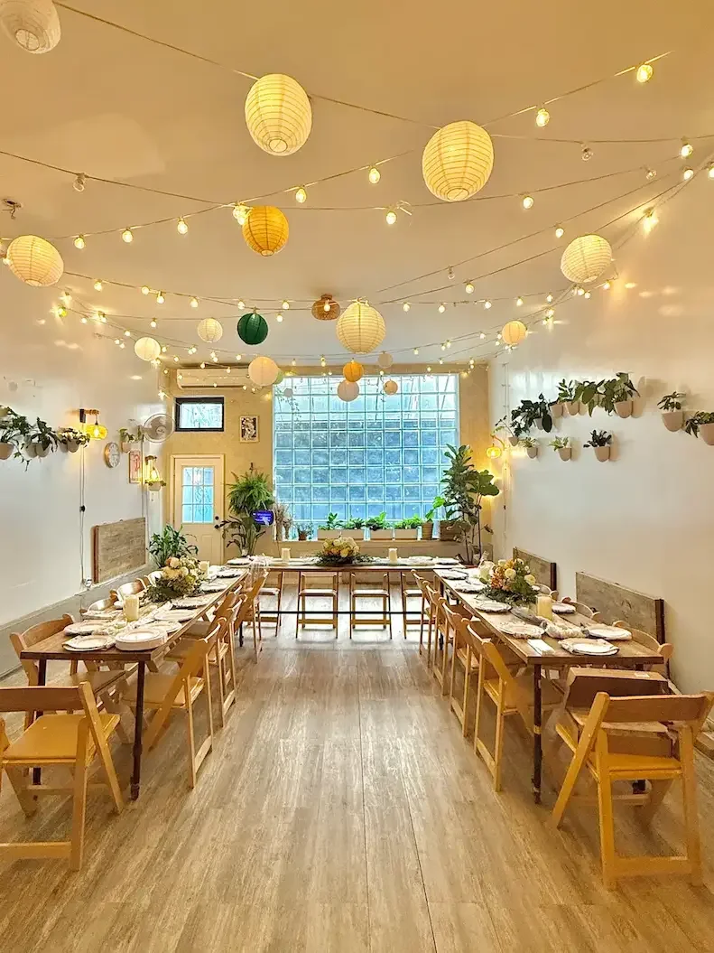 Styled Package bridal shower at Bat Haus — long tables with peach linens, candles, and seasonal florals in Williamsburg Brooklyn