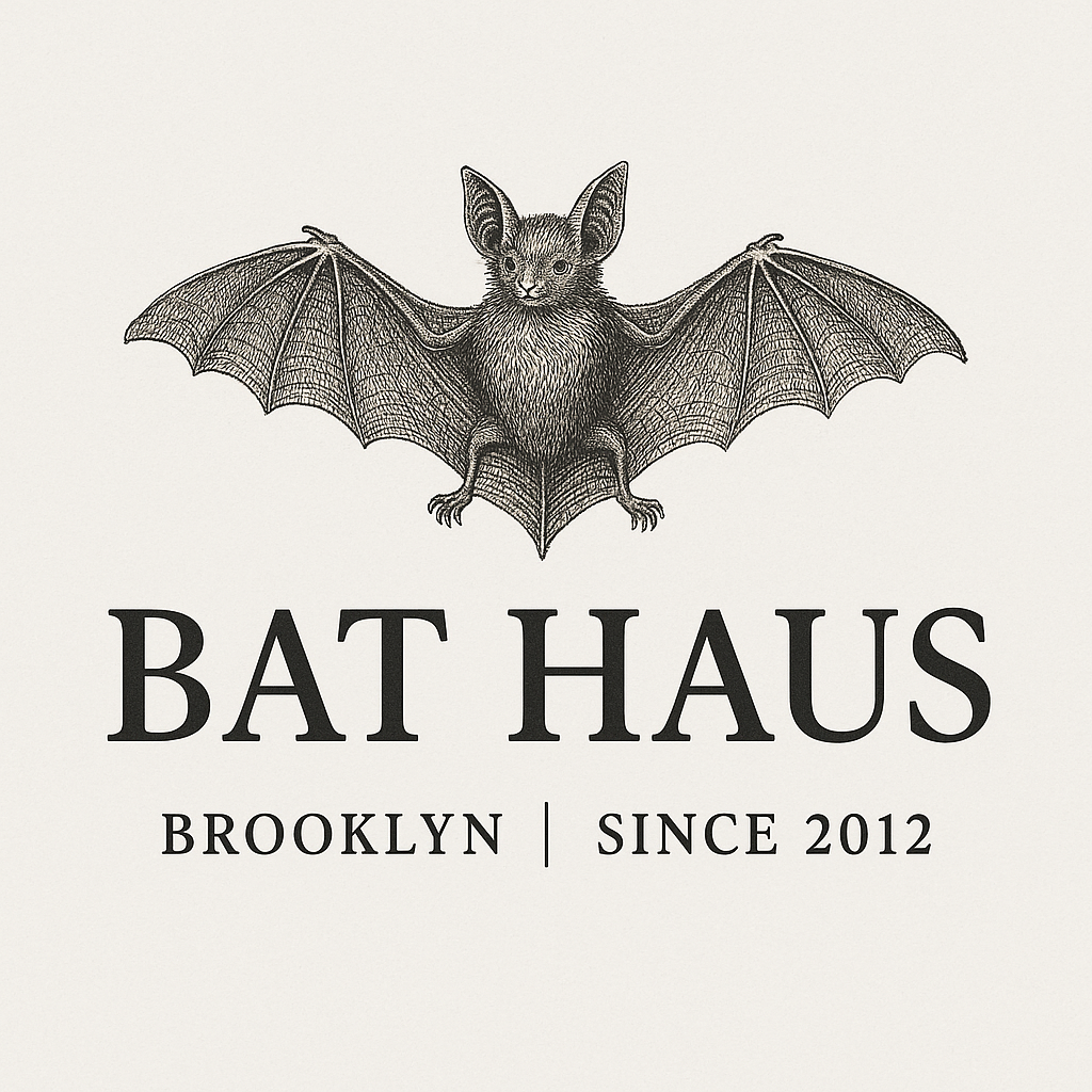 Logo for Bat Haus in Brooklyn, featuring a detailed illustration of a bat with a cat's head, bat wings, and a furry body, with the text 'Bat Haus Brooklyn Since 2012' underneath.
