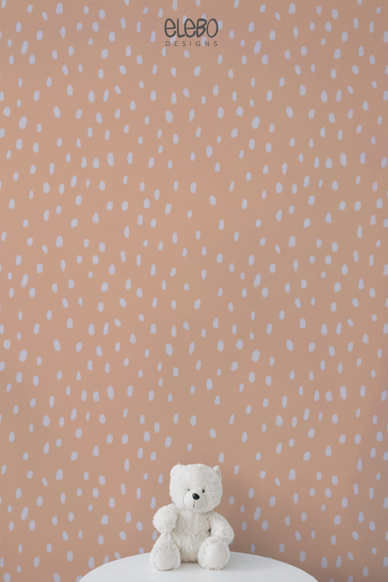 spots-light-peach-and-white-nursery-with-teddy-bear.webp