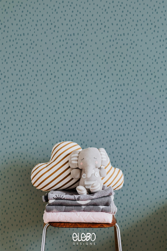 spots-light-blue-nursery-with-toy-elephant.webp
