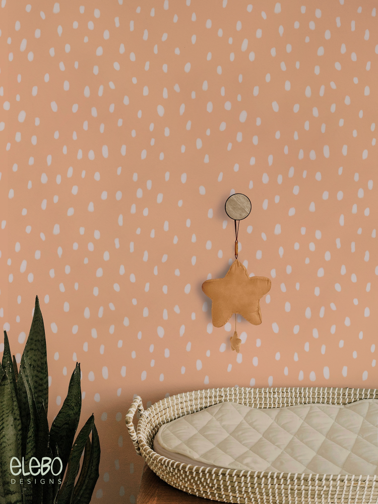 spots-light-peach-and-white-boho-nursery.webp